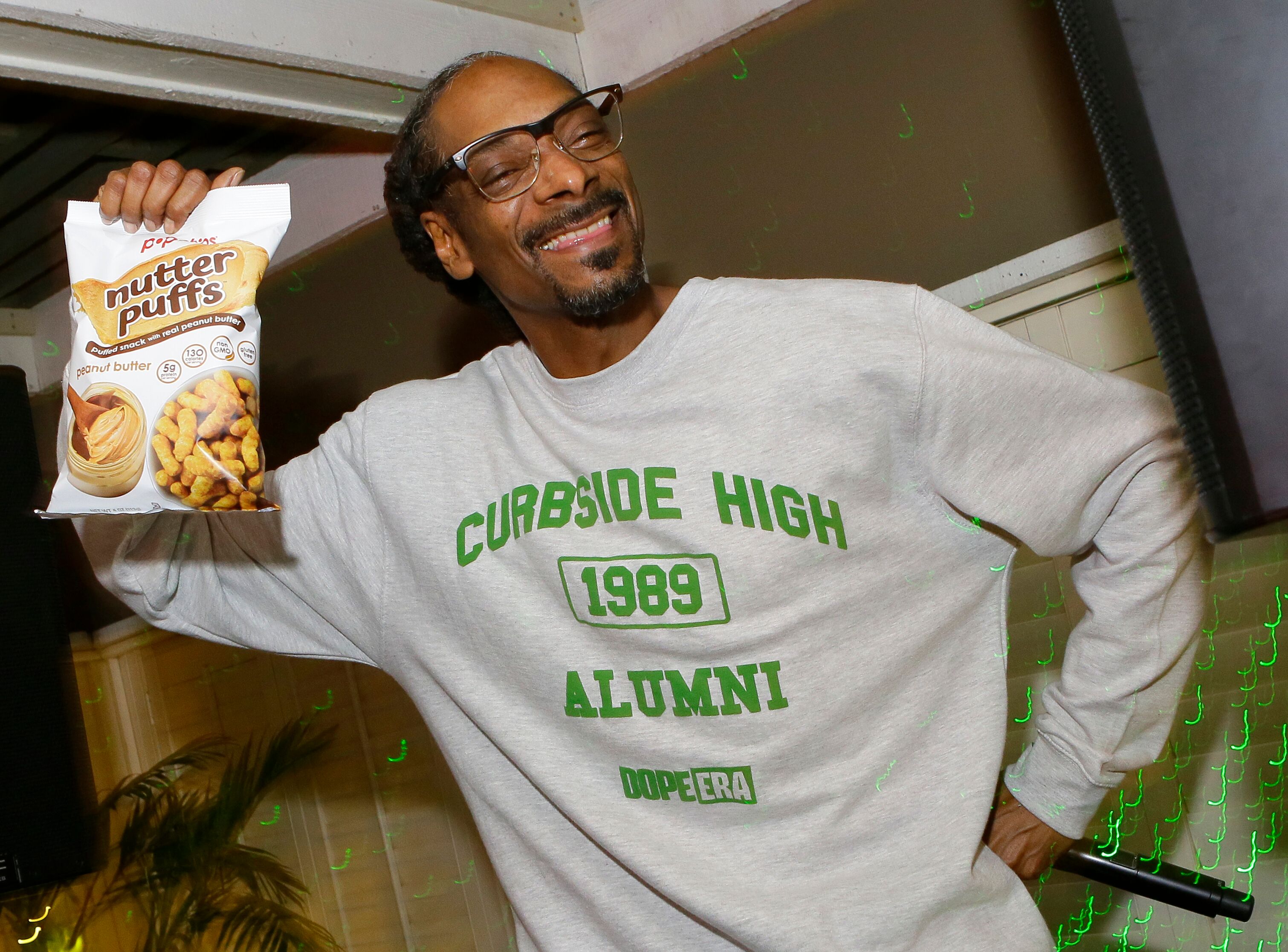 Rapper Snoop Dogg wearing a mock high school sweatshirt/ Source: Getty Images