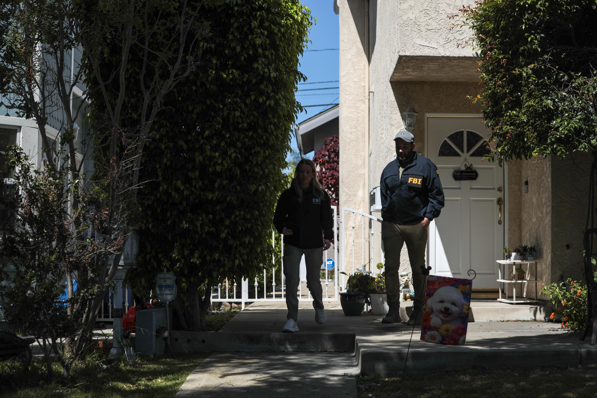 FBI agents gather information from neighbors of Cole Thomas Allen, the suspected gunman at the White House Correspondents' dinner, on April 26, 2026, in Torrance, California | Source: Getty Images