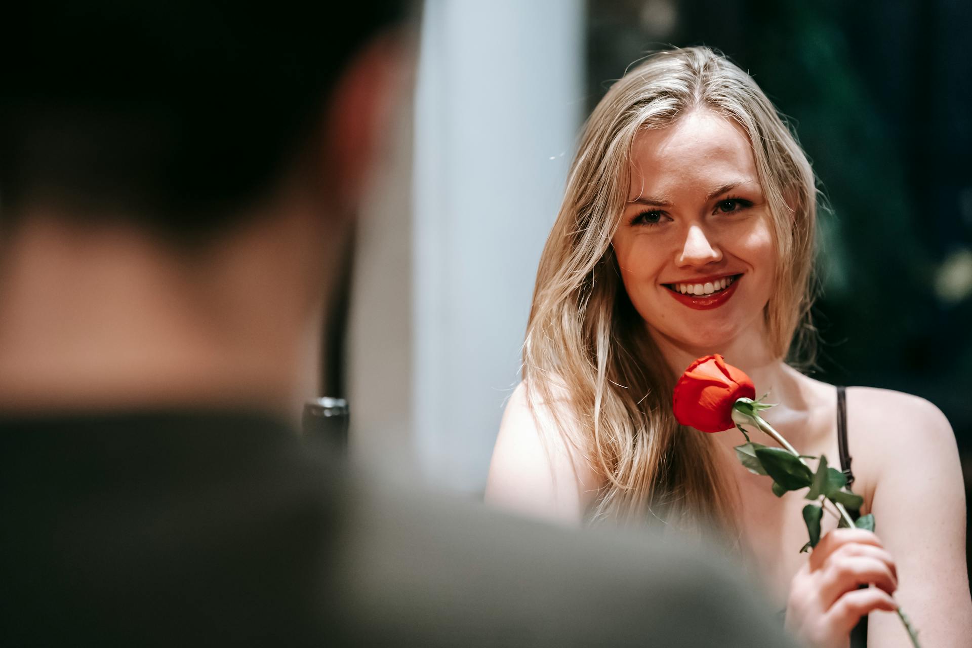 A woman smiling at her boyfriend | Source: Pexels
