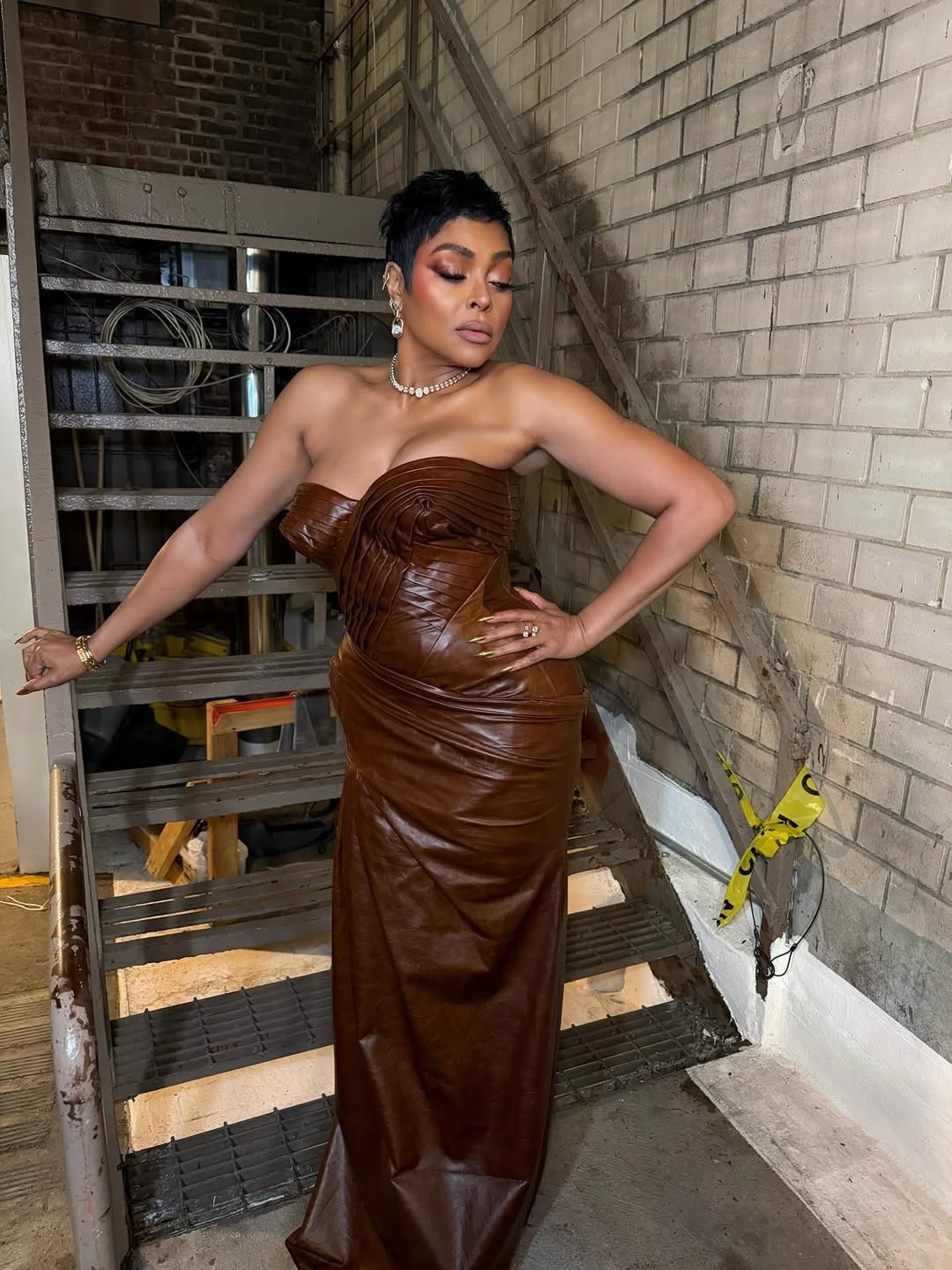 Taraji P. Henson posing in her brown leather gown, posted on April 25, 2026. | Source: Instagram/tarajiphenson