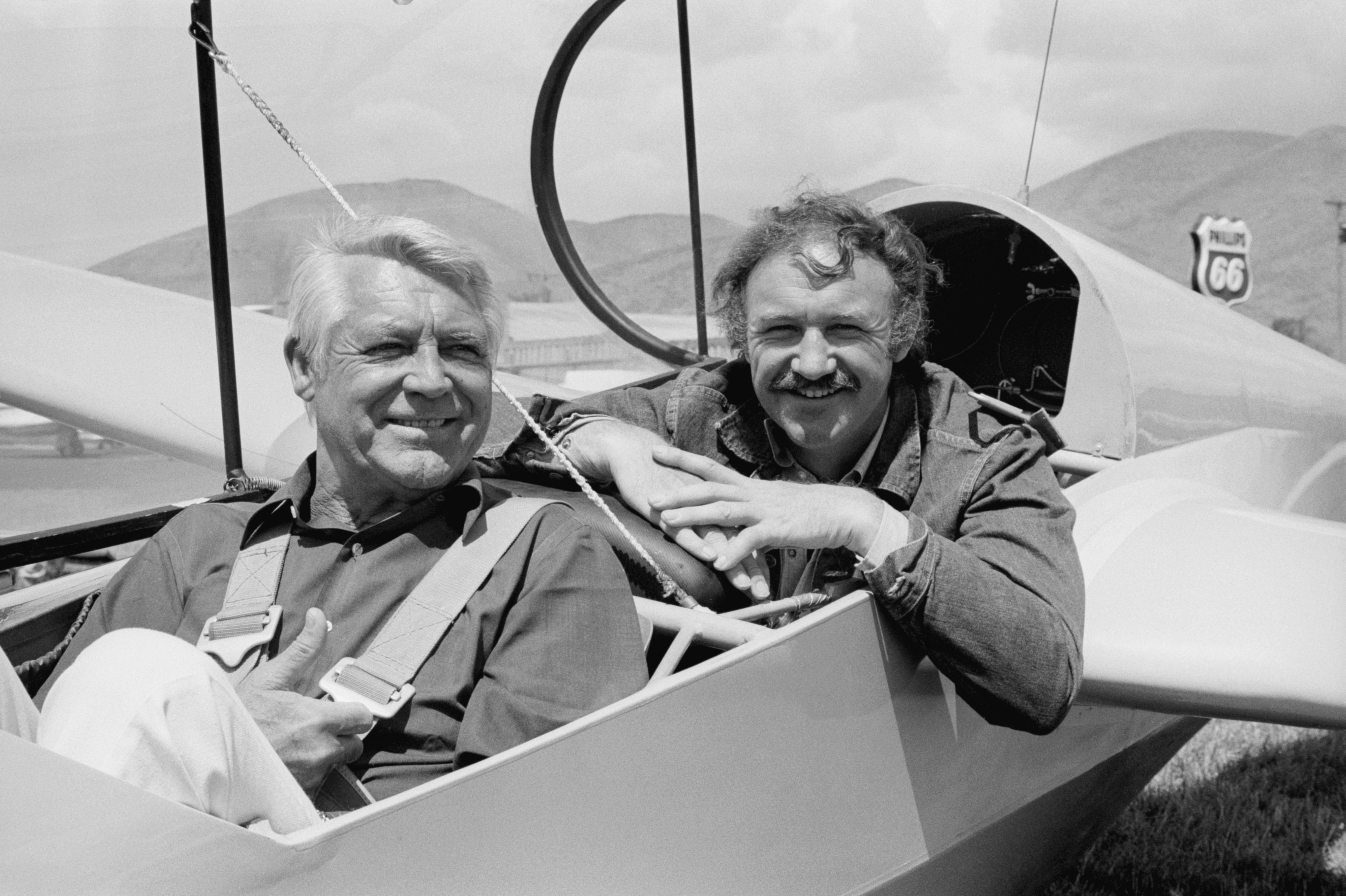 Cary Grant and Gene Hackman in a Glider During Brut Film Festival, circa August 1973 | Source: Getty Images