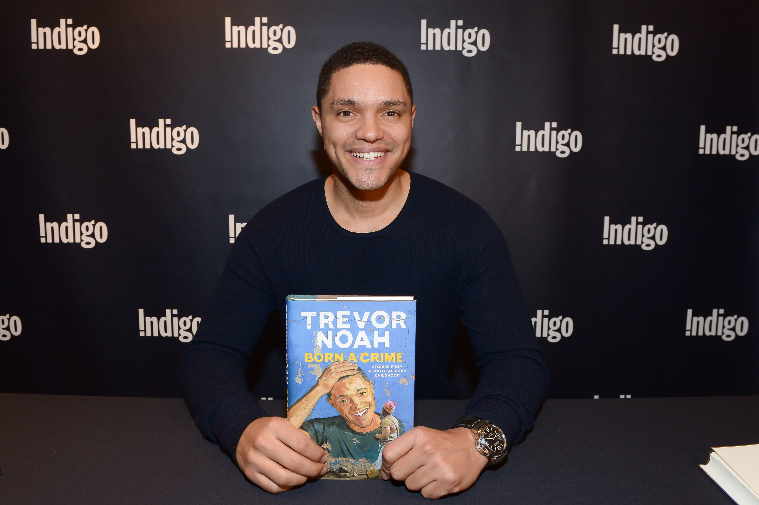 Trevor Noah signs copies of his new book "Born A Crime" at Indigo Eaton Centre on December 2, 2016 in Toronto, Canada. | Source: Getty Images