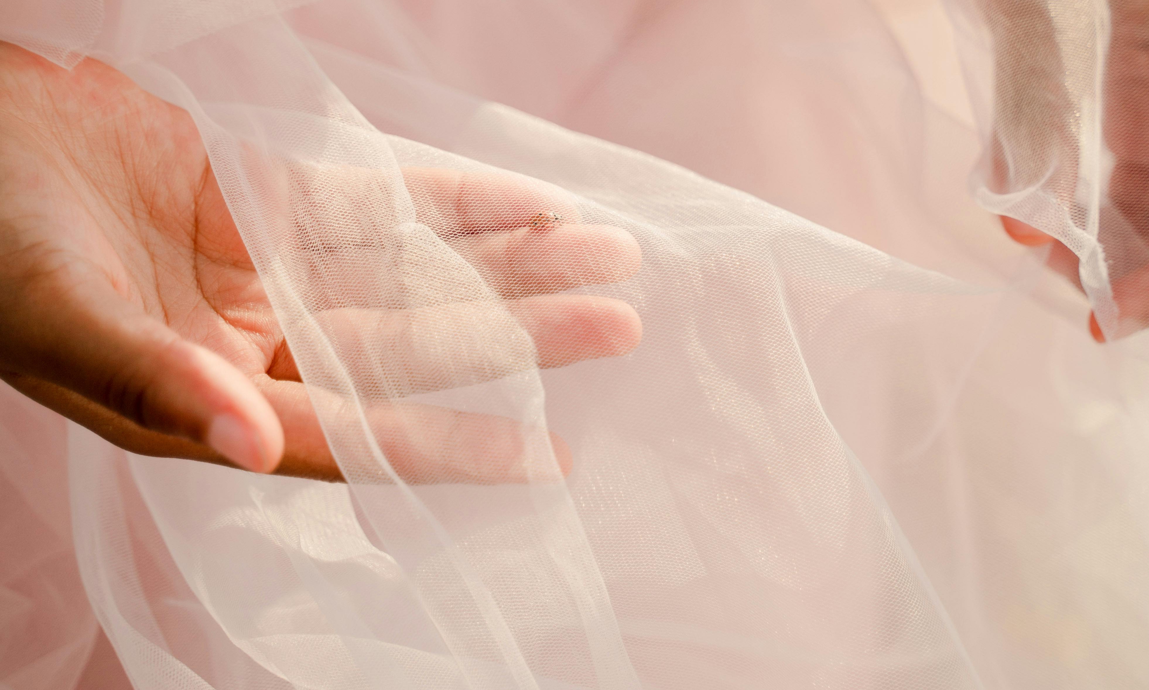 The bridesmaid dresses exhibiting pastel shades and intricate lacework | Source: Pexels