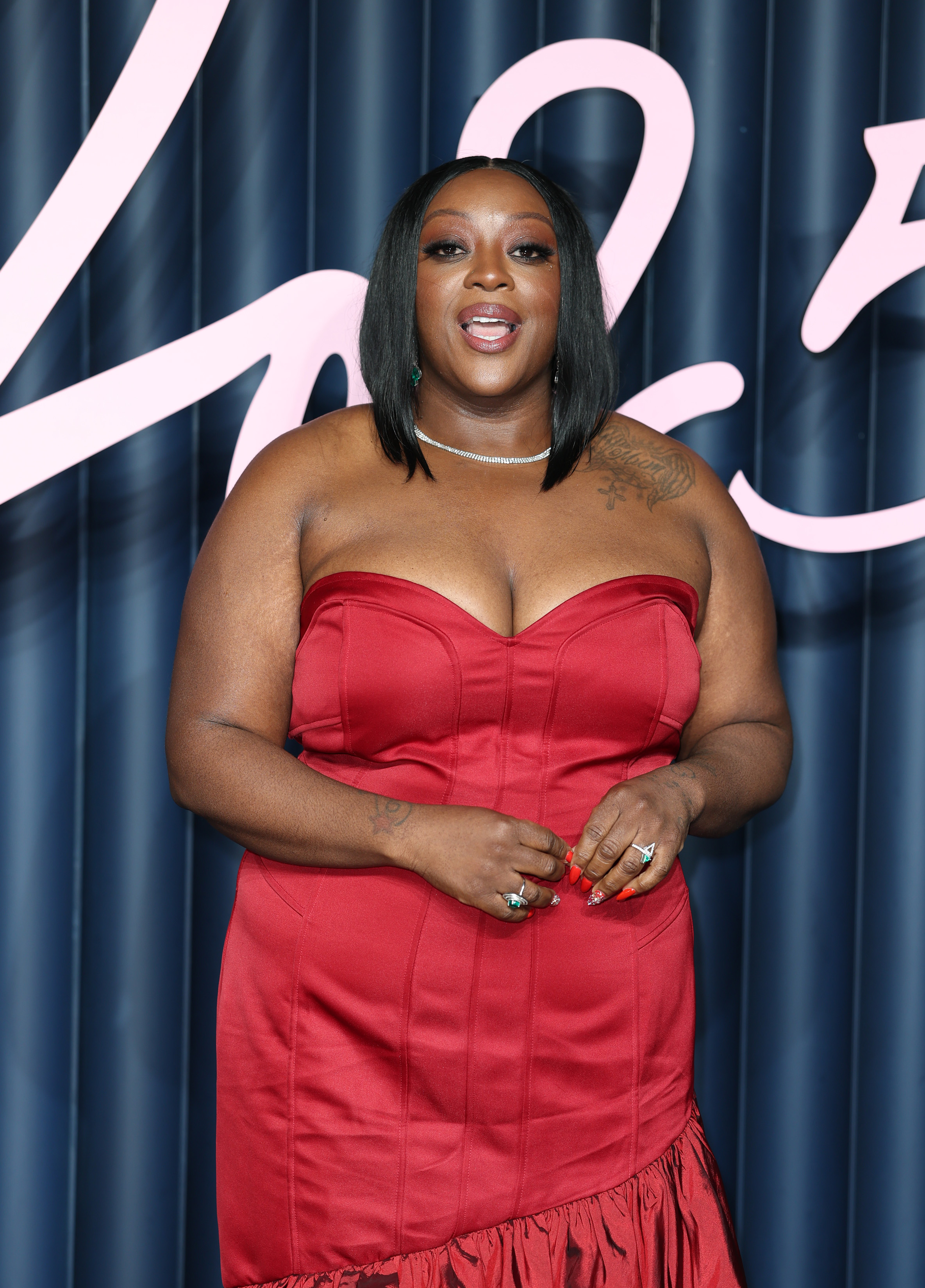 Love brings full red-carpet drama to The Fashion Awards at the Royal Albert Hall, stepping out in a show-stopping strapless red gown that hugs every curve. With sleek shoulder-length hair, bold jewellery, and undeniable presence, the television star owns the night from every angle.