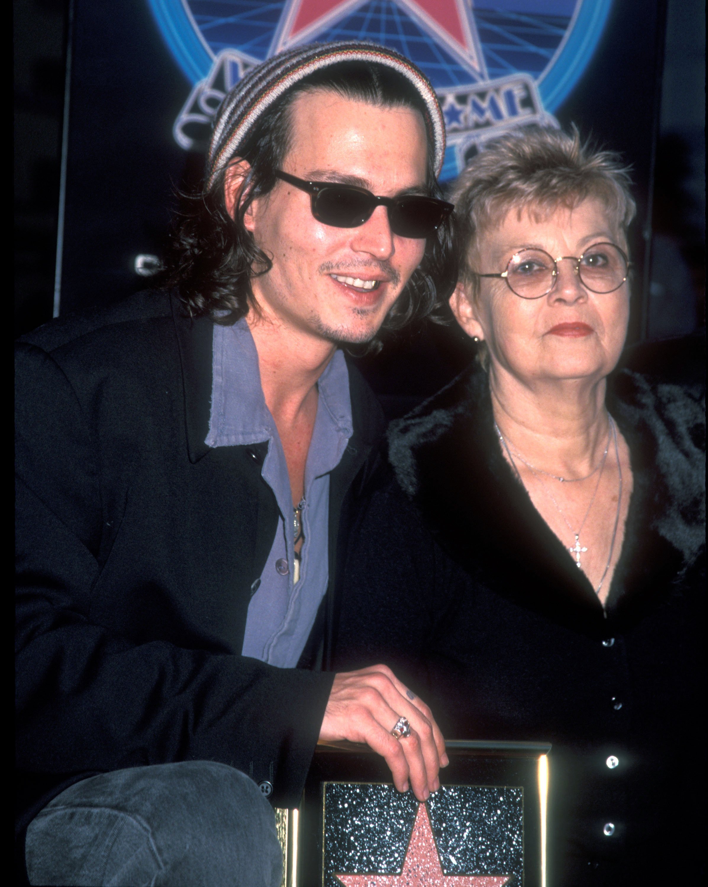 Johnny Depp and Betty Sue Palmer posed while he was honored with a star on the Hollywood Walk of Fame on November 16, 1999. | Source: Barry King/WireImage/Getty Images