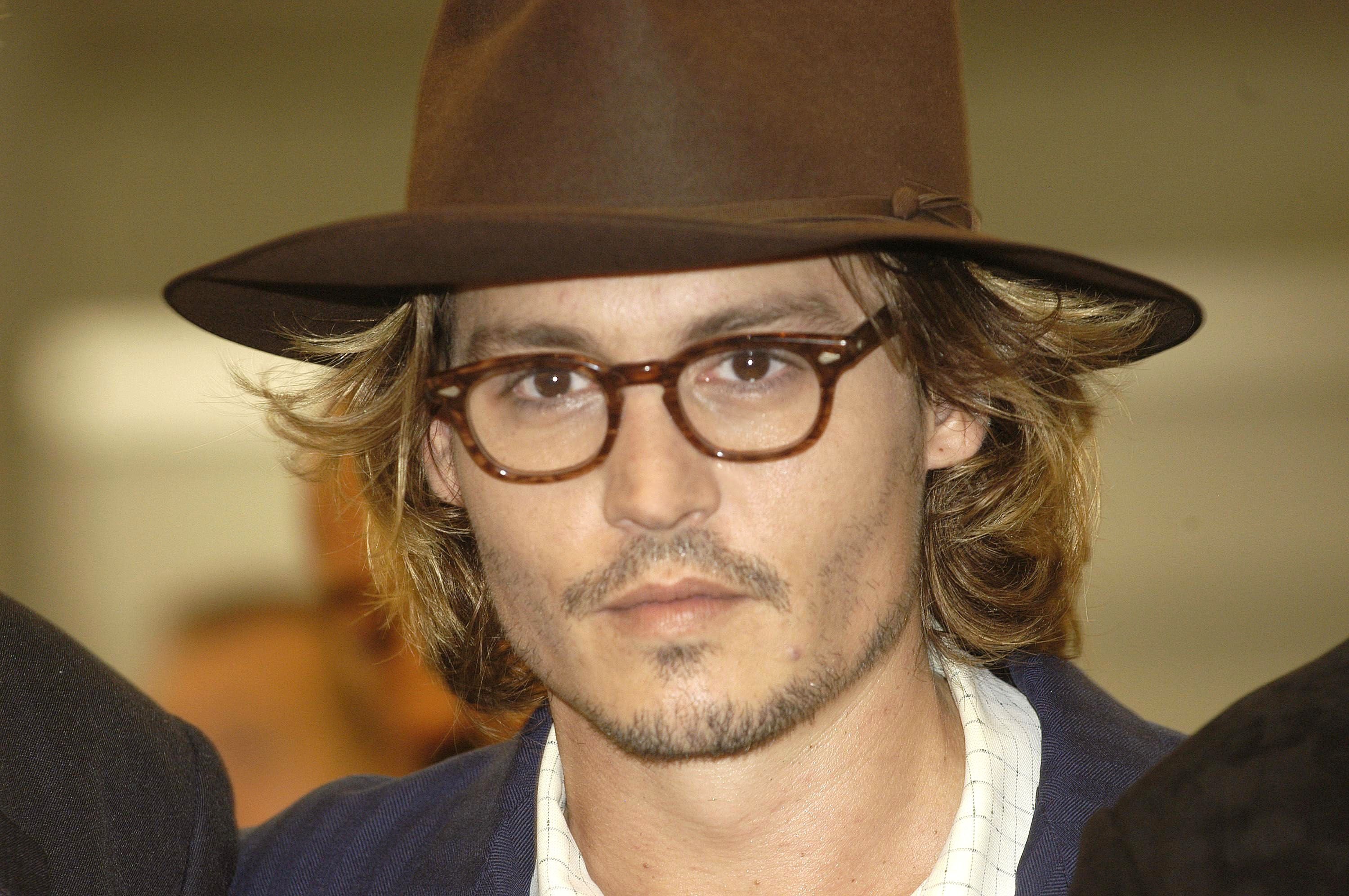 Johnny Depp at the premiere of "Once Upon a Time in Mexico" at the 60th Venice Film Festival on August 28, 2003, in Italy | Photo: Franco Origlia/Getty Images