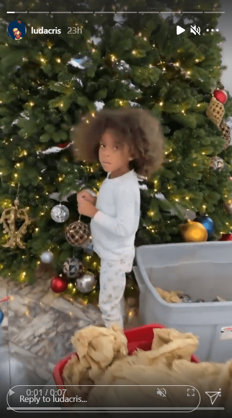 A screenshot from Ludacris' Instagram story featuring his daughter Cadence decorating their Christmas tree. | Source: Instagram.com/Ludacris