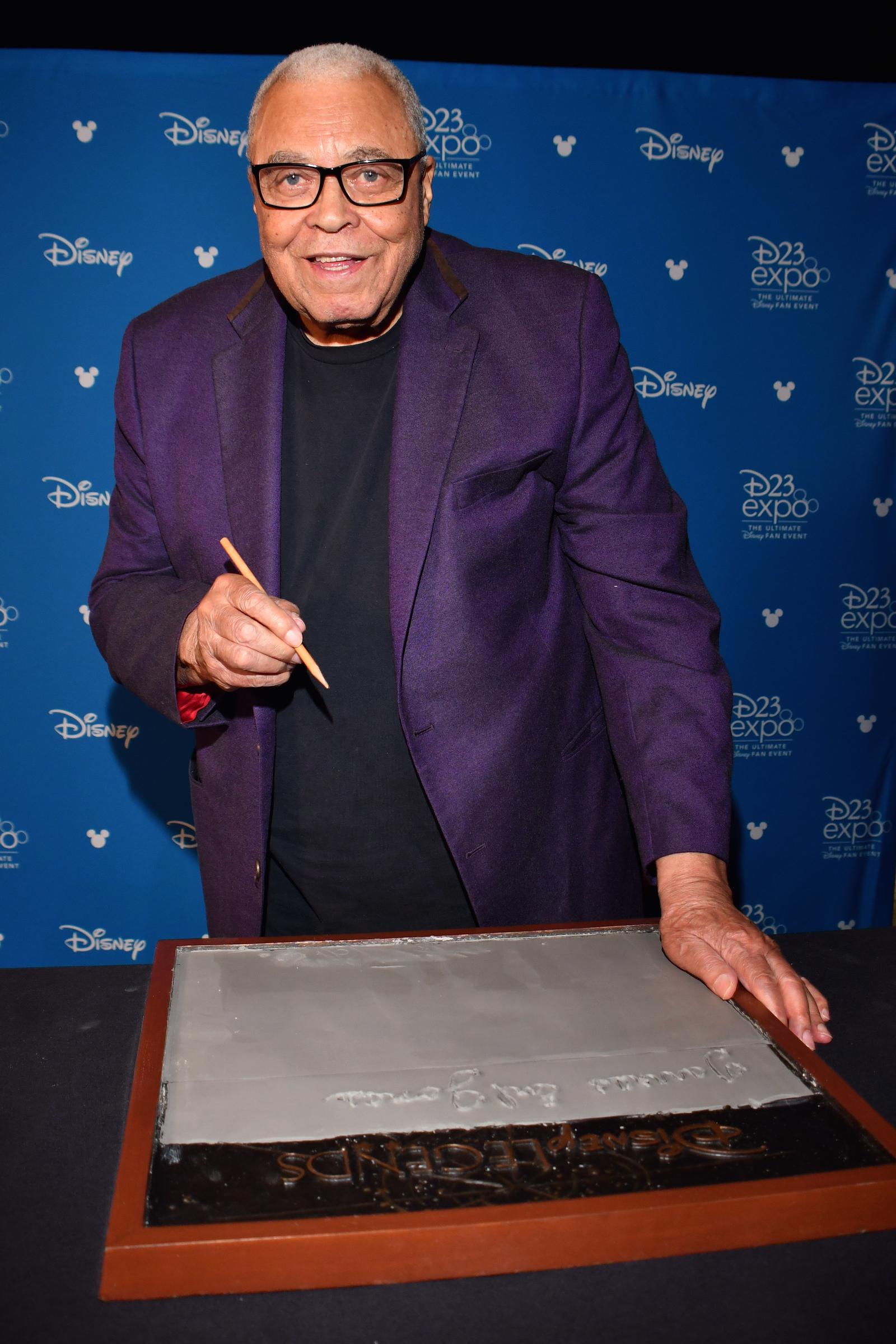 James Earl Jones shown casting his hand in cement for Disney during a special event on July 10, 2019, in Pawling, New York. | Source: Getty Images