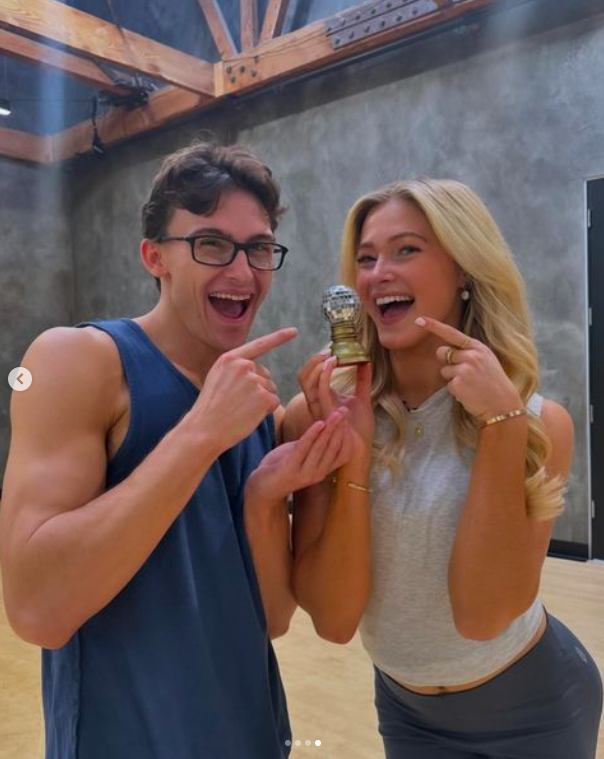 Stephen Nedoroscik and Rylee Arnold posing for a picture with a miniature Mirrorball trophy, posted on November 24, 2024 | Source: Instagram/dancingwiththestars