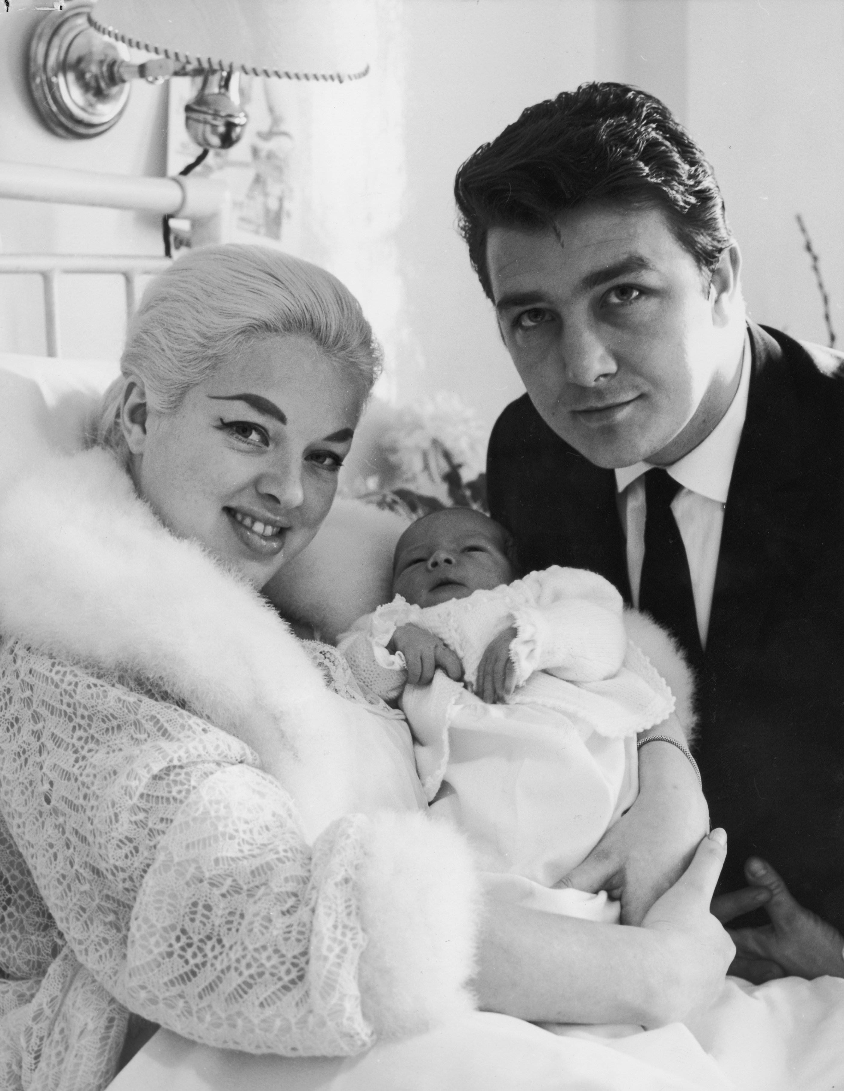 Diana Dors and Richard Dawson with their first baby, Mark, on February 9, 1960. | Source: Derek Berwin/Fox Photos/Getty Images