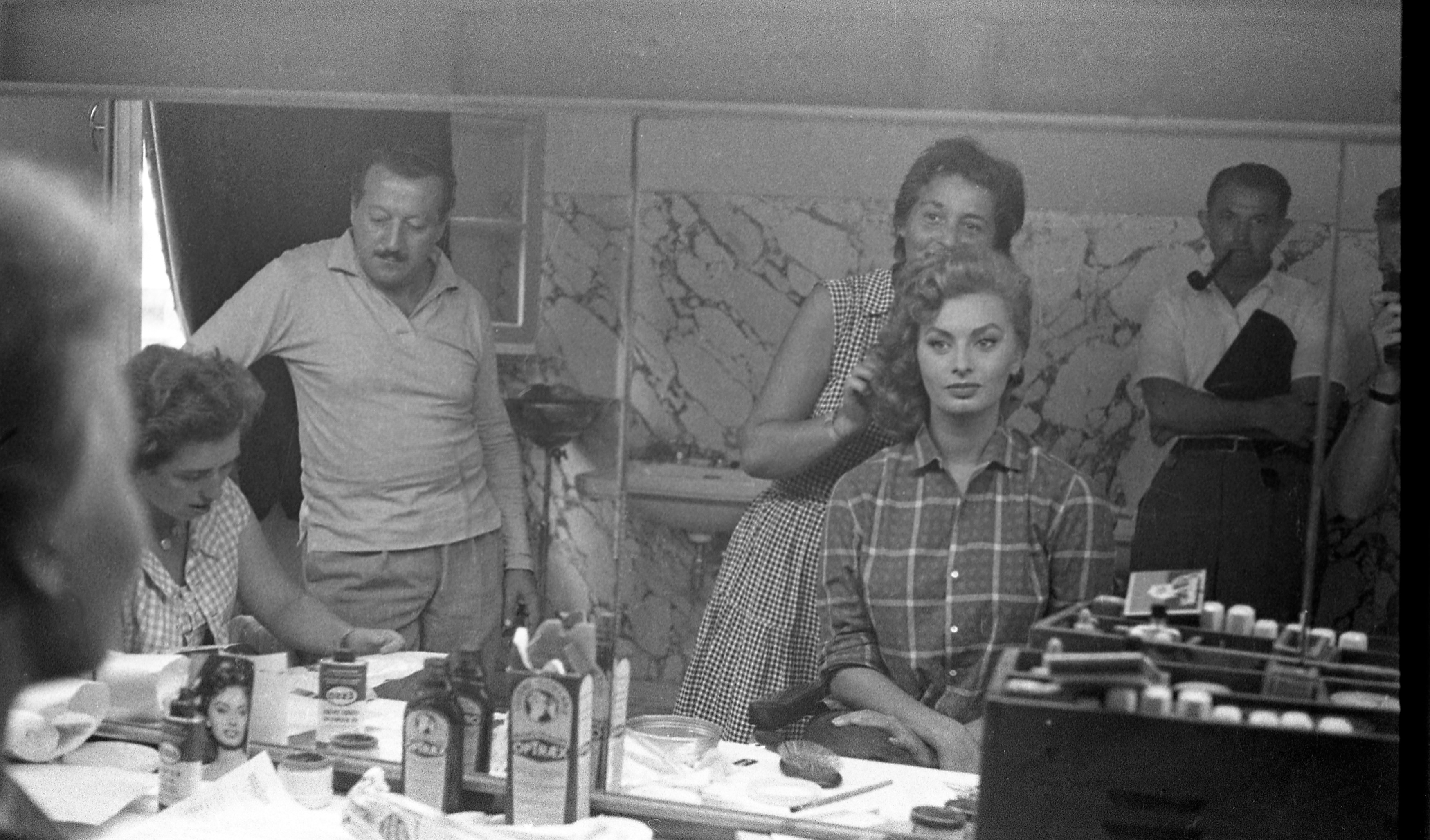 The actress getting her makeup done on a movie set, circa 1955. | Source: Getty Images