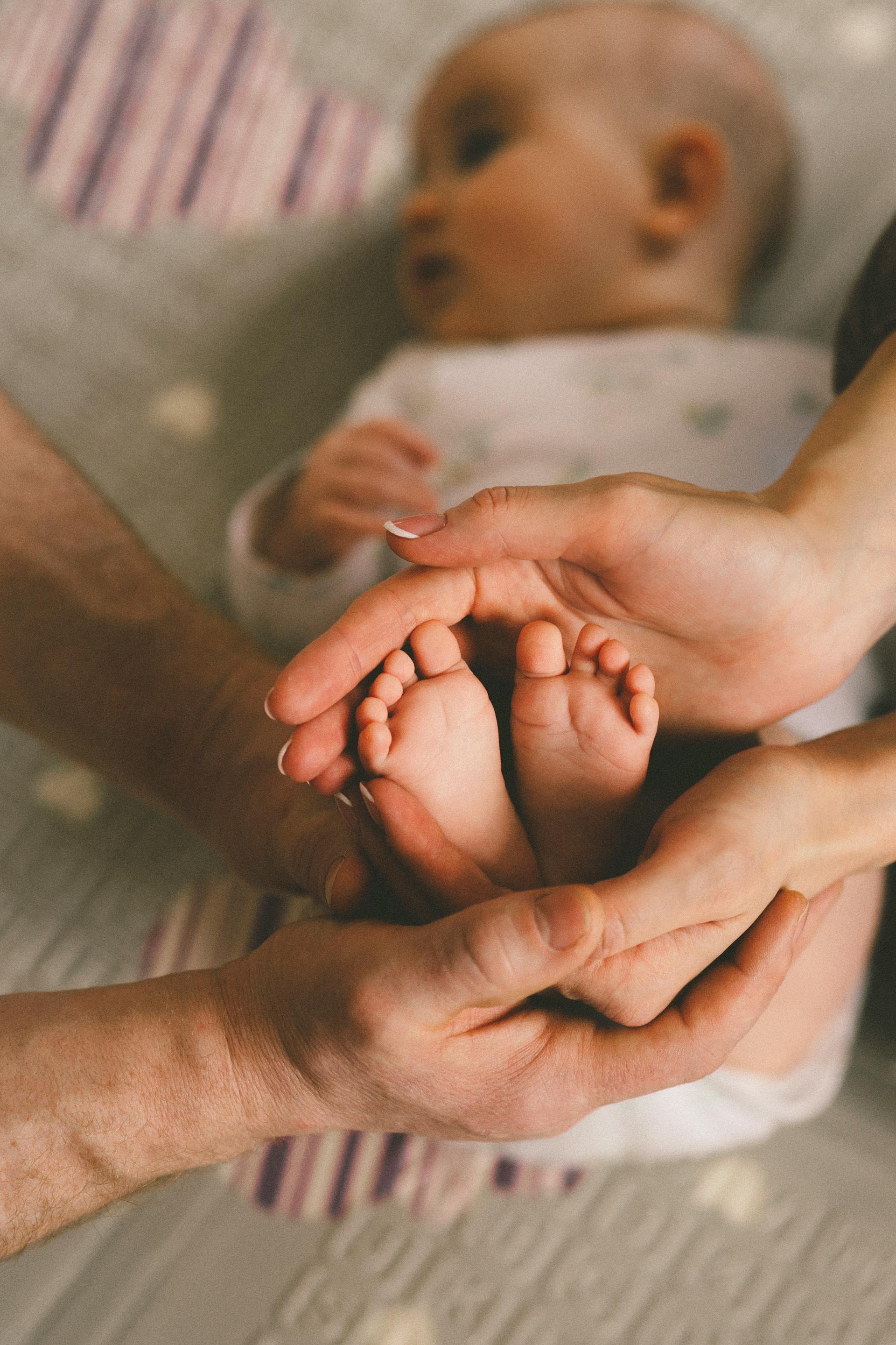 A couple with a cute little baby | Source: Pexels