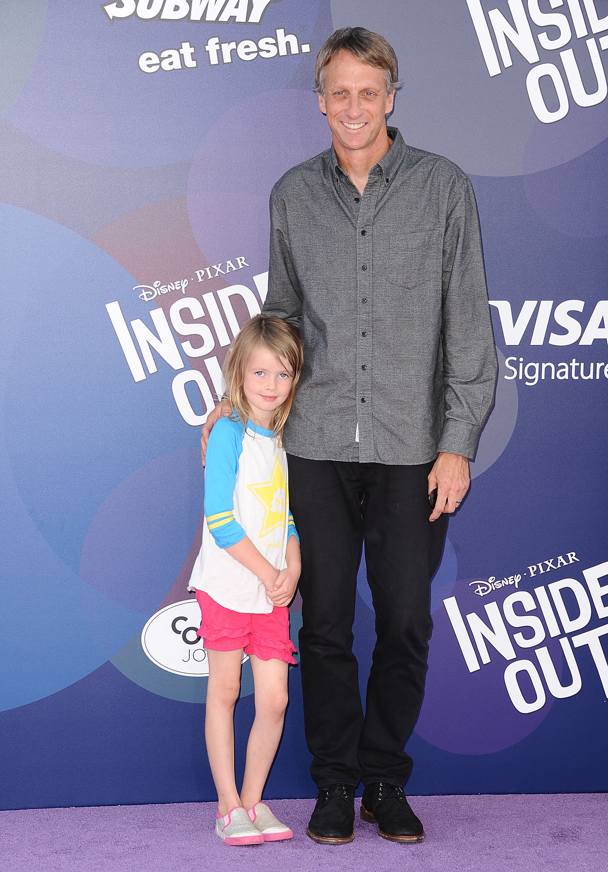 Tony Hawk and his daughter, Kadence Clover, pose on the red carpet at the premiere of "Inside Out" on June 8, 2015, in Hollywood | Source: Getty Images