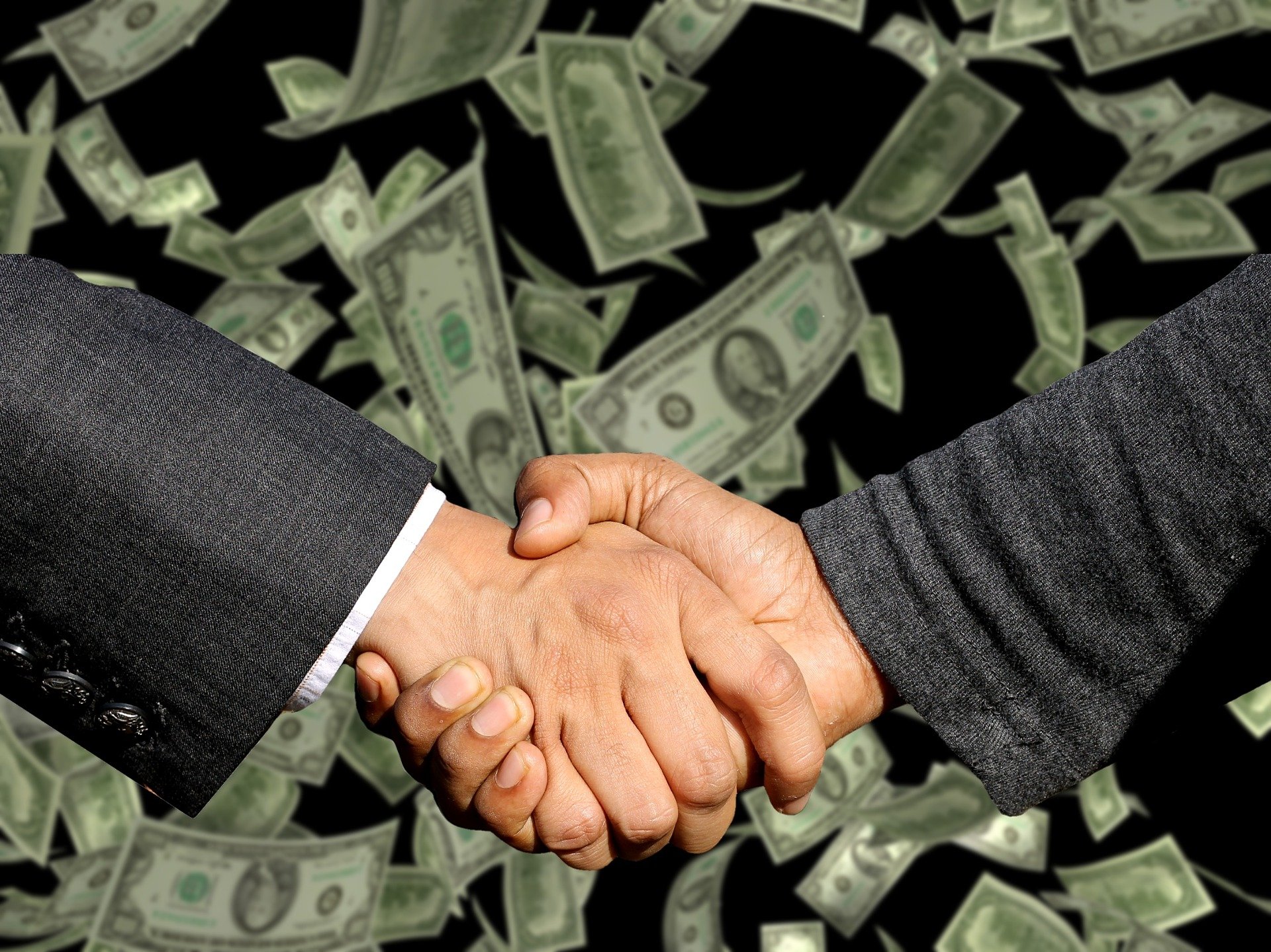 Two people shake hands after making a business deal. | Source: Pixabay.