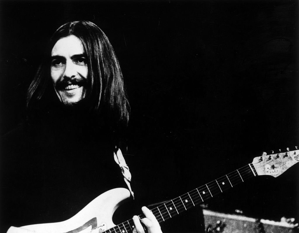 George Harrison (1943 - 2001) of the Beatles at a concert in Copenhagen with Eric Clapton and Delaney and Bonnie | Getty Images / Global Images Ukraine George Harrison (1943 - 2001) of the Beatles at a concert in Copenhagen with Eric Clapton and Delaney and Bonnie | Getty Images / Global Images Ukraine