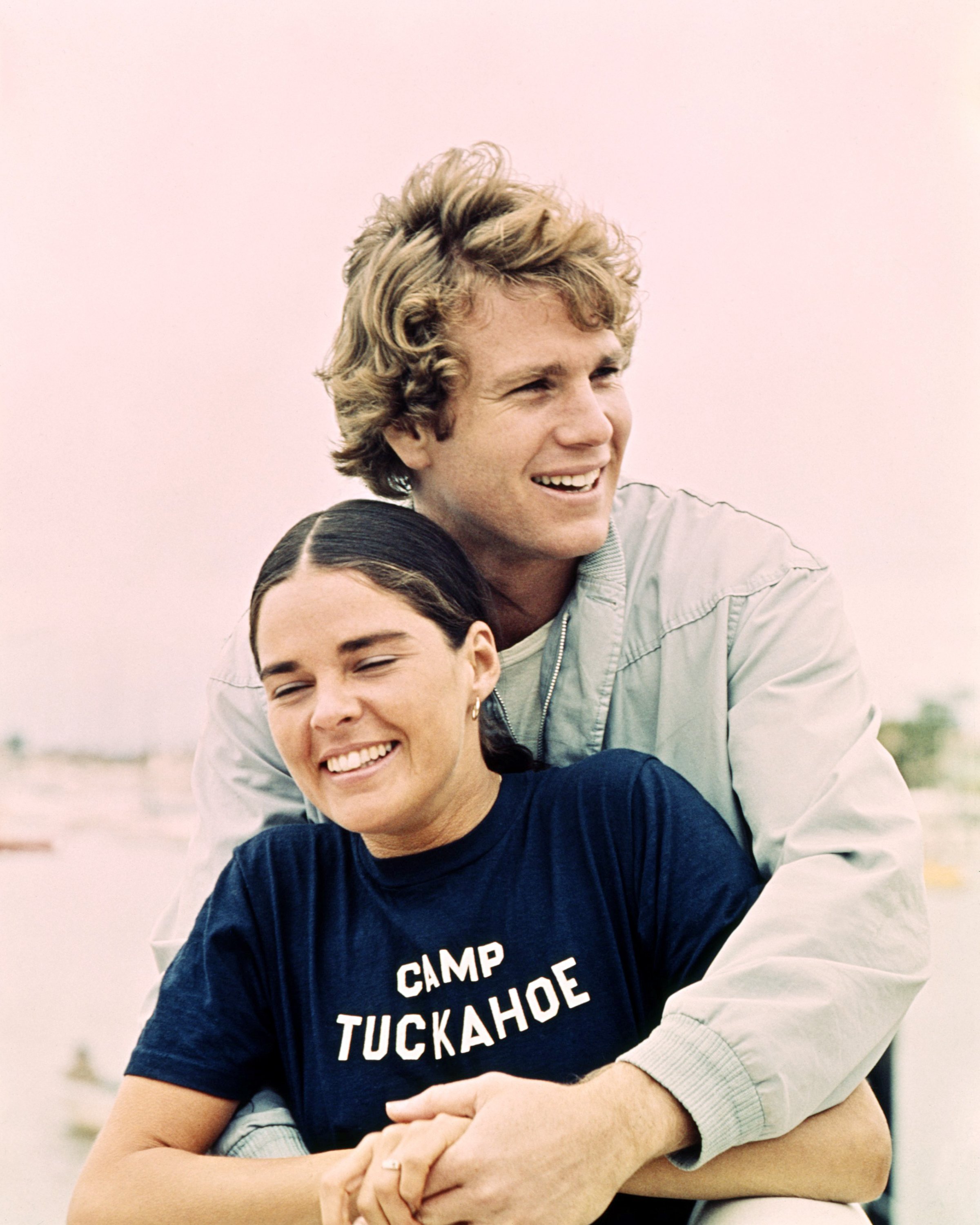 Actor Ryan O'Neal and Ali MacGraw photographed in a promotional portrait for the classic movie "Love Story" in 1970. | Source: Getty Images