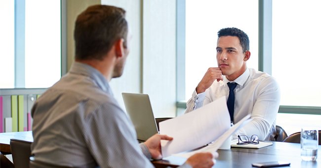 Two men having a conversation | Photo: Shutterstock