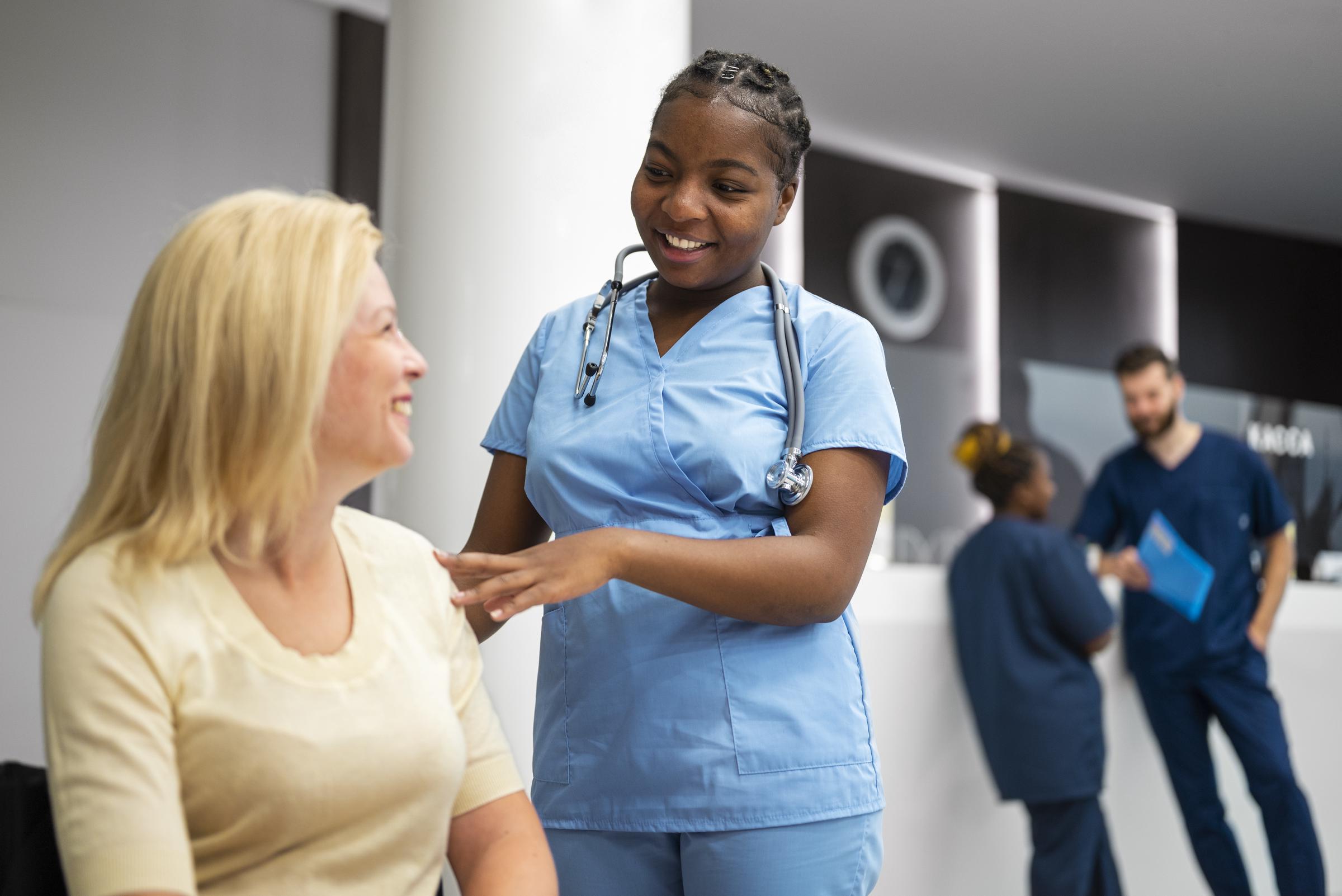 A nurse working with a patient | Source: Freepik