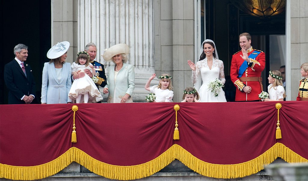 Prince William, Kate Middleton with family and their pageboys and bridesmaids on the balcony of Buckingham Palace. | Photo: Getty Images