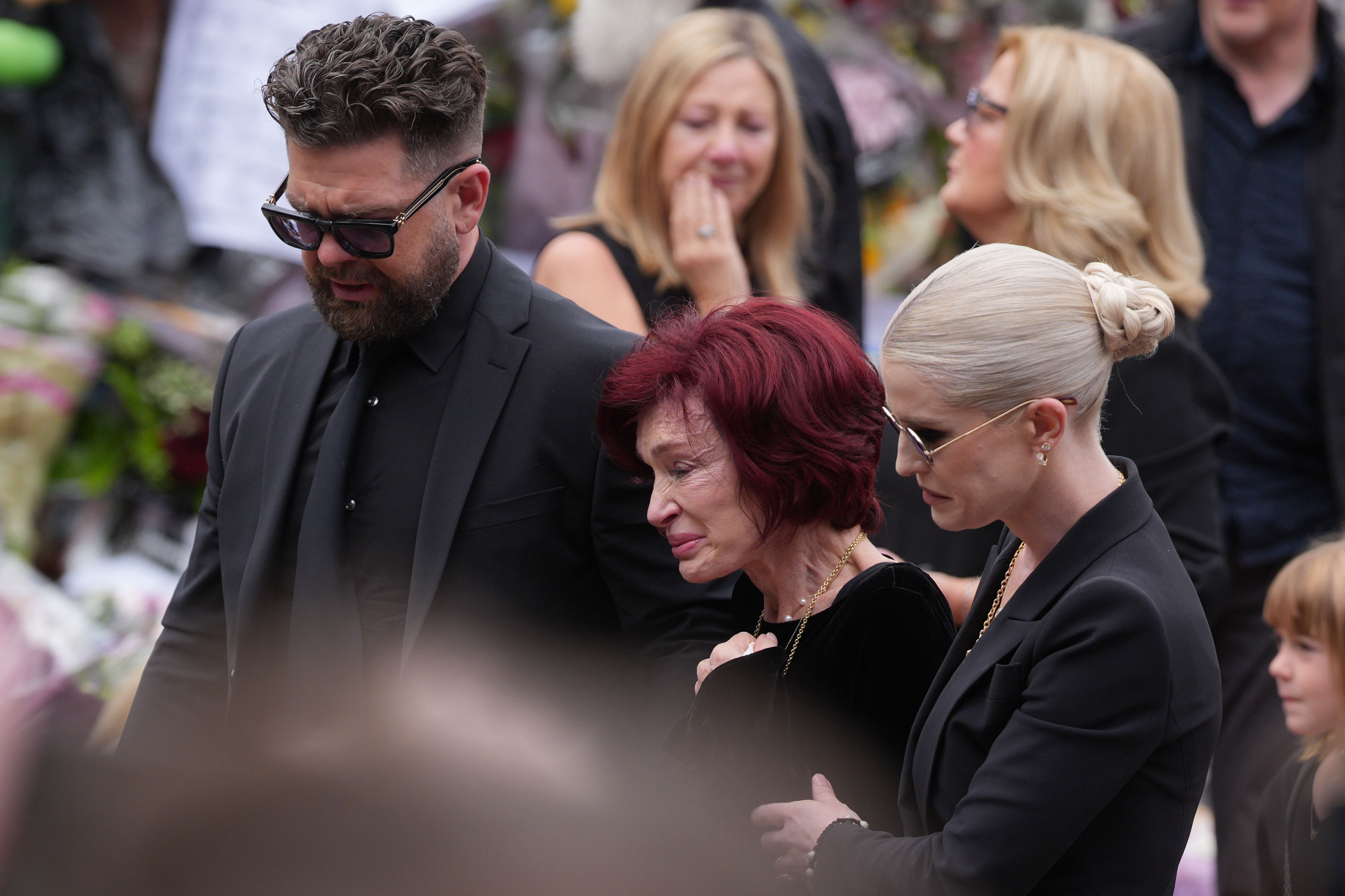 Jack, Sharon, and Kelly Osbourne attend the funeral ceremony for Ozzy Osbourne on July 30, 2025 in Birmingham, England. | Source: Getty Images