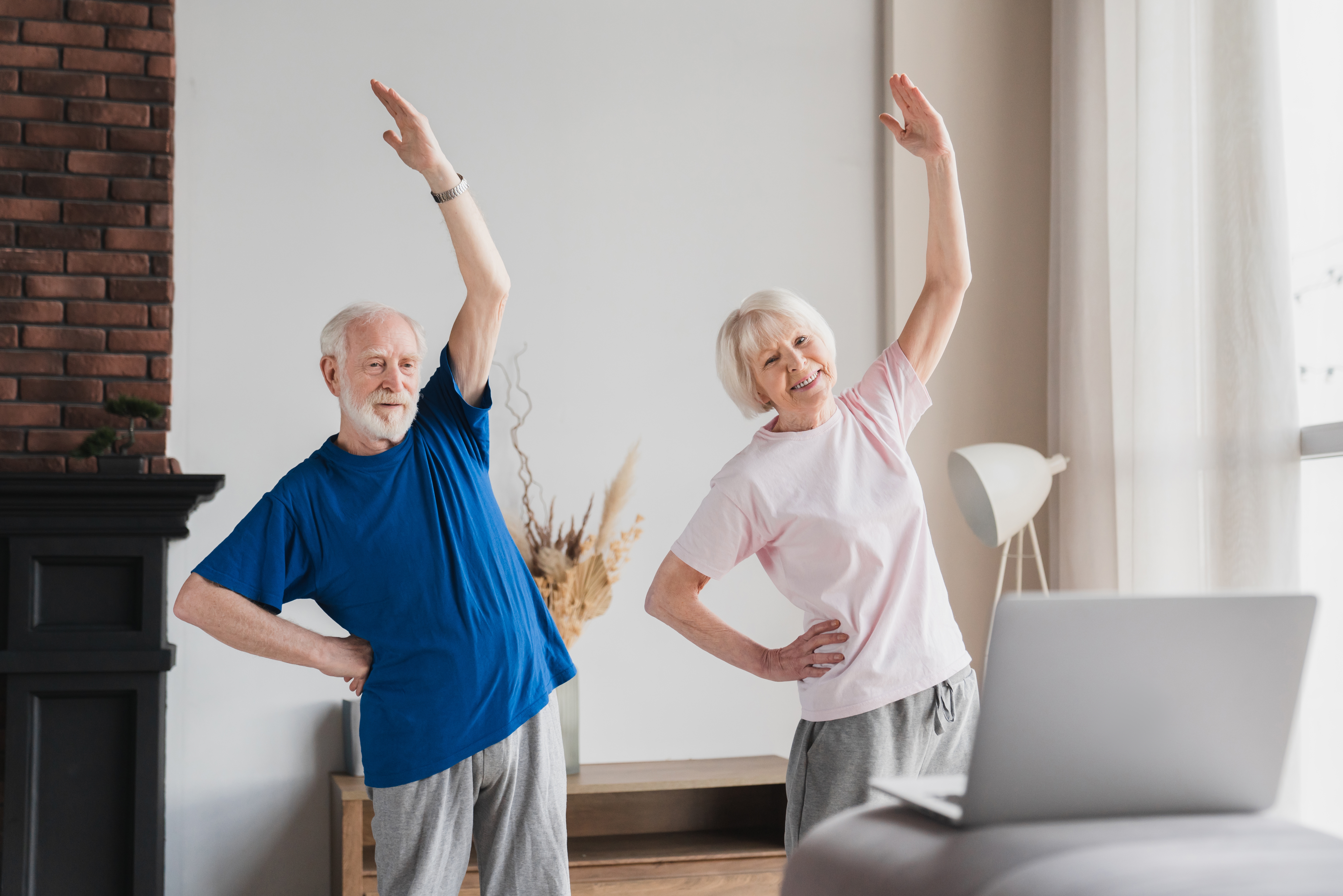 A senior couple doing fitness training indoors | Source: Shutterstock