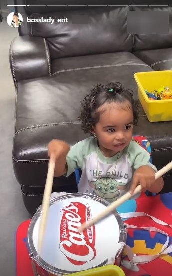 A picture of Shante Broadus' granddaughter beating a drum. | Photo: Instagram/Bosslady_ent 