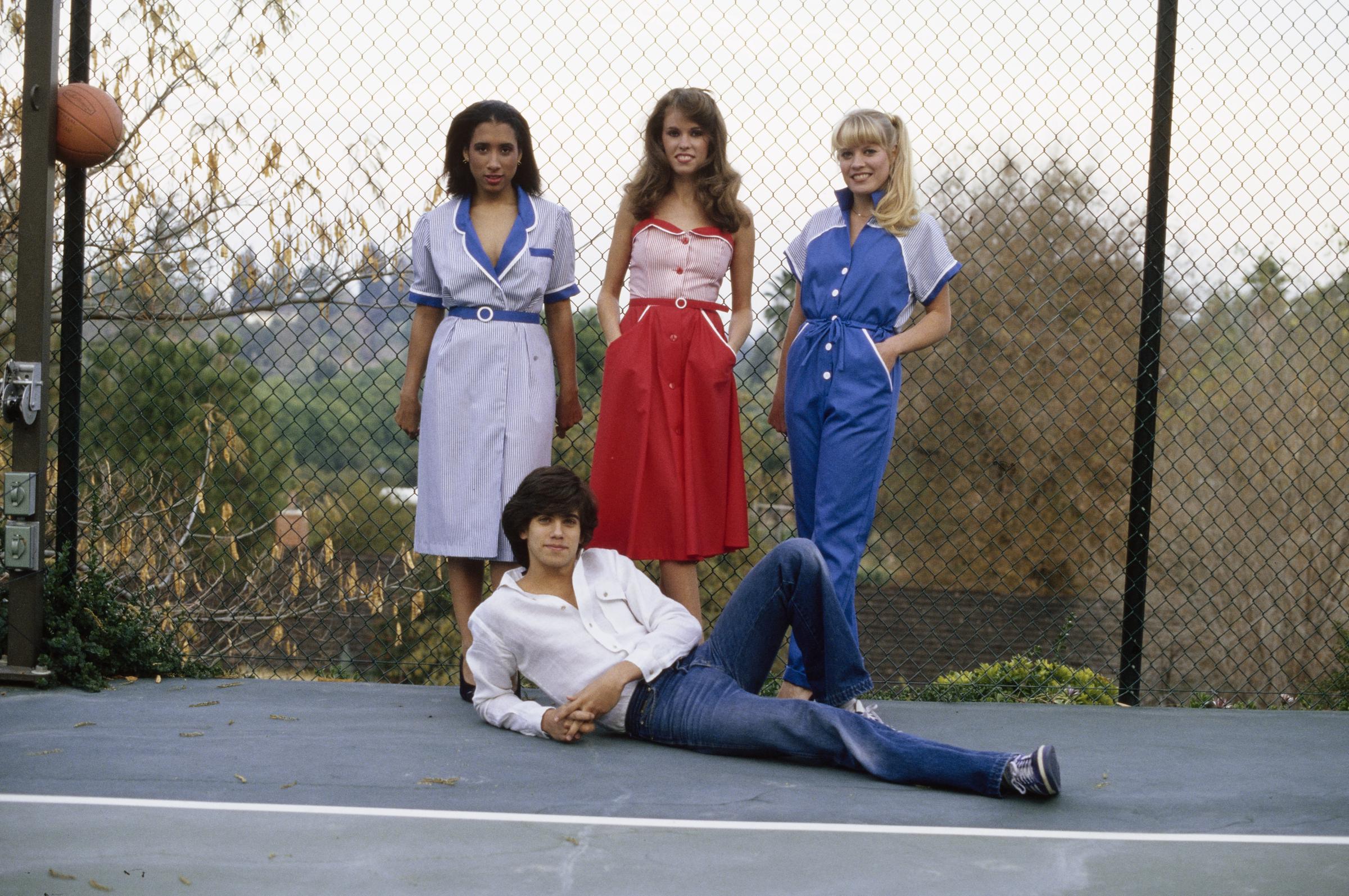 Robby Benson pictured with three women during a fashion portrait session for "Tiger Beat" magazine, circa 1974 | Source: Getty Images