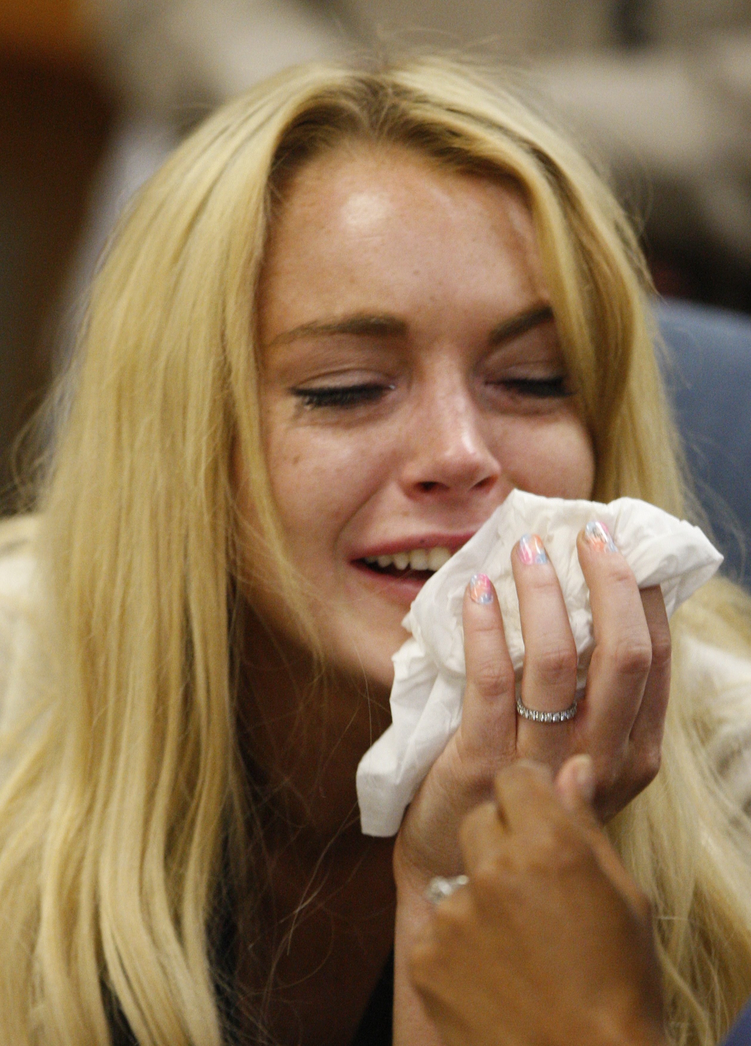 Lindsay Lohan cries as she is sentenced to 90 days jail time by Judge Marsha Revel during her hearing at the Beverly Hills Courthouse on July 6, 2010. | Source: Getty Images