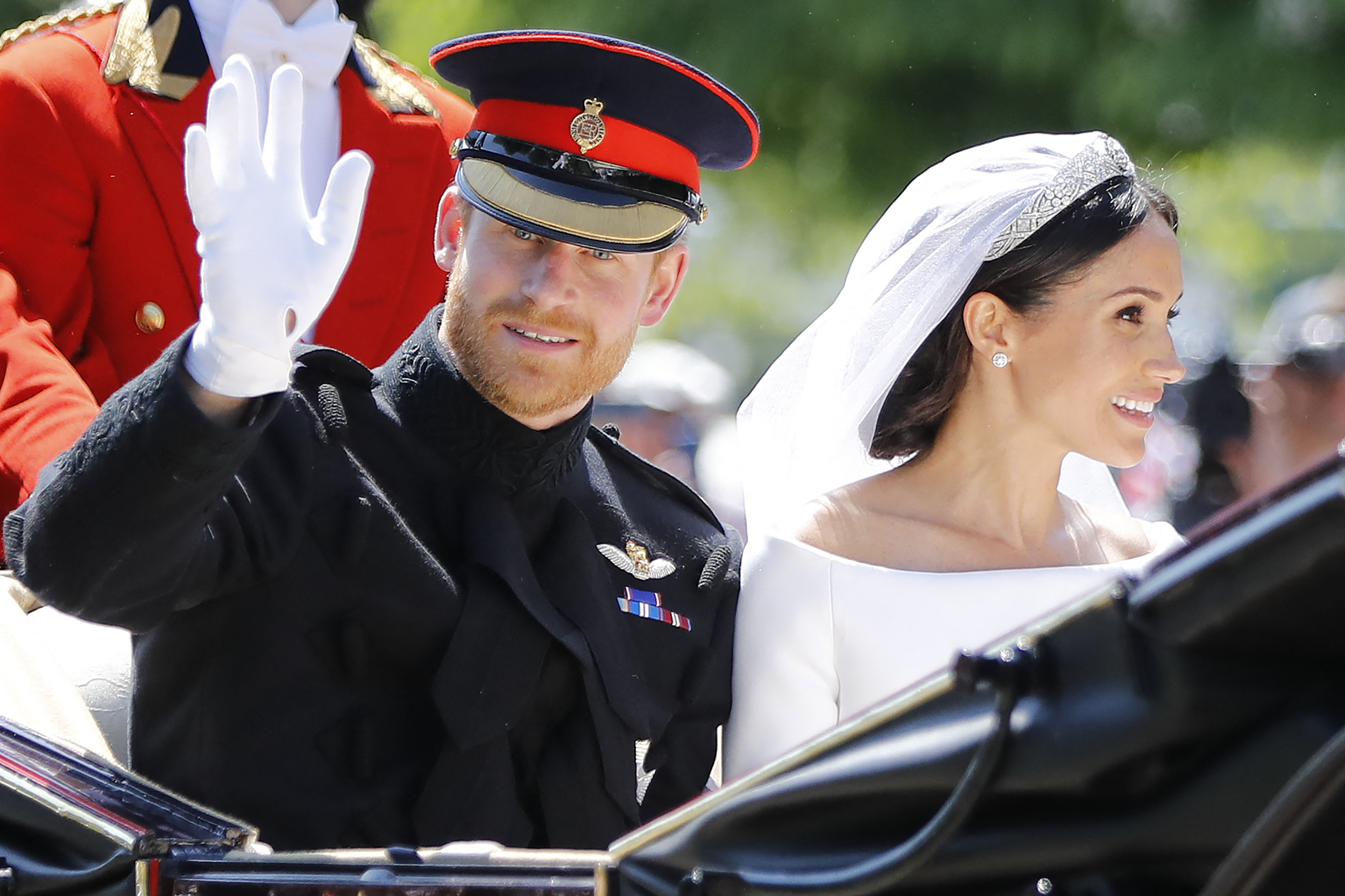 Prince Harry and Meghan Markle during their carriage procession on the Long Walk on May 19, 2018, in Windsor, England. | Source: Getty Images