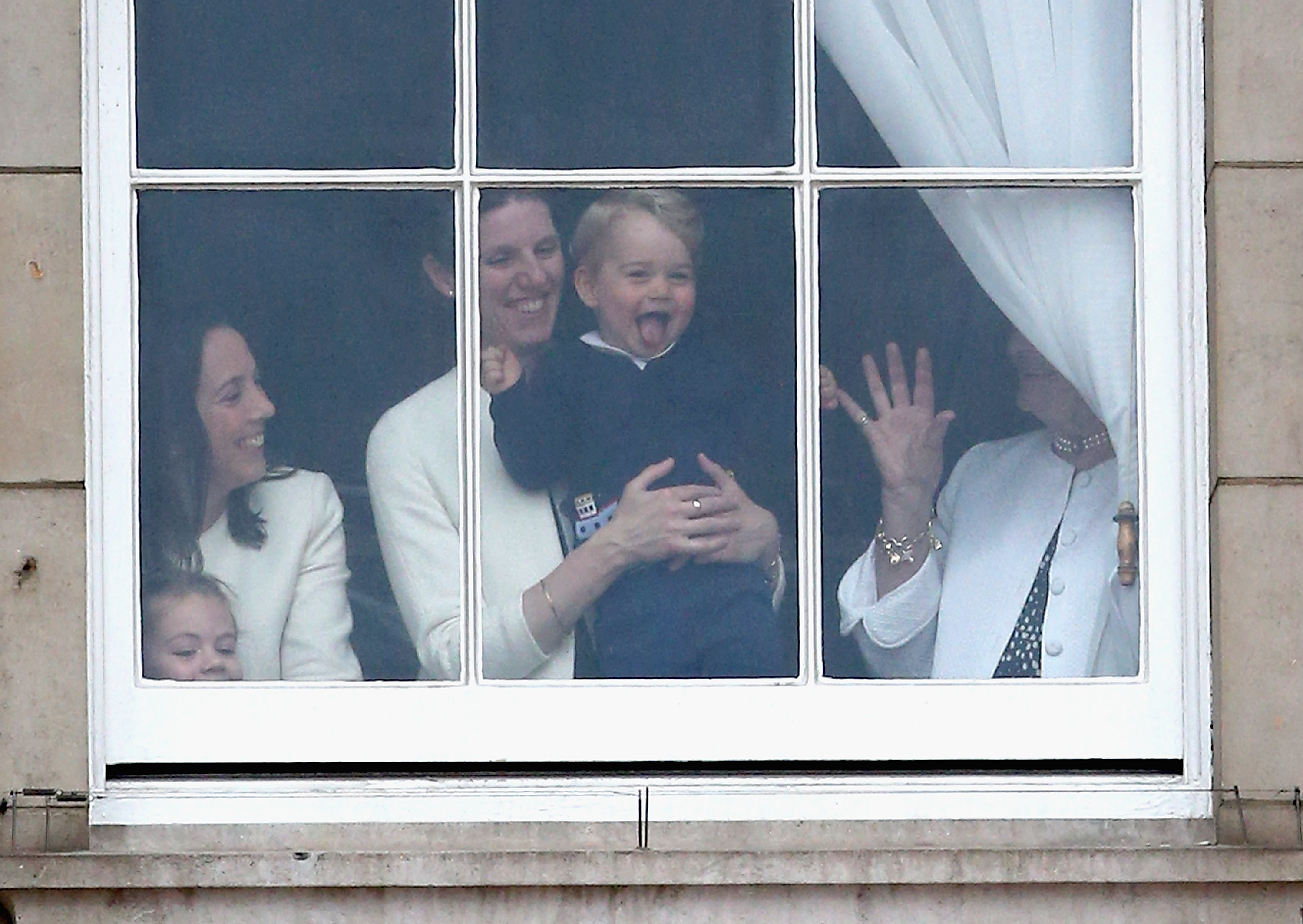 Prince George, Maria Borrallo, and others watch the Trooping The Colour from the window on June 13, 2015 in London, England | Source: Getty Images