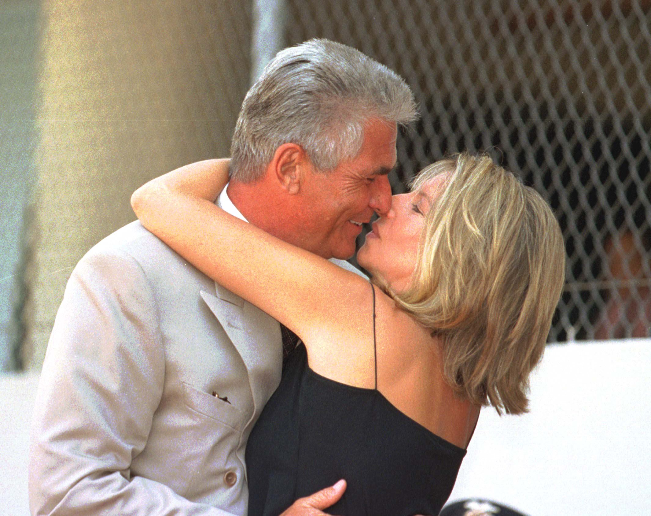 US singer and actress Barbra Streisand gives her husband actor James Brolin a kiss during his Hollywood star installation on the Walk of Fame in Hollywood, California, on August 27 1998 | Source: Getty Images