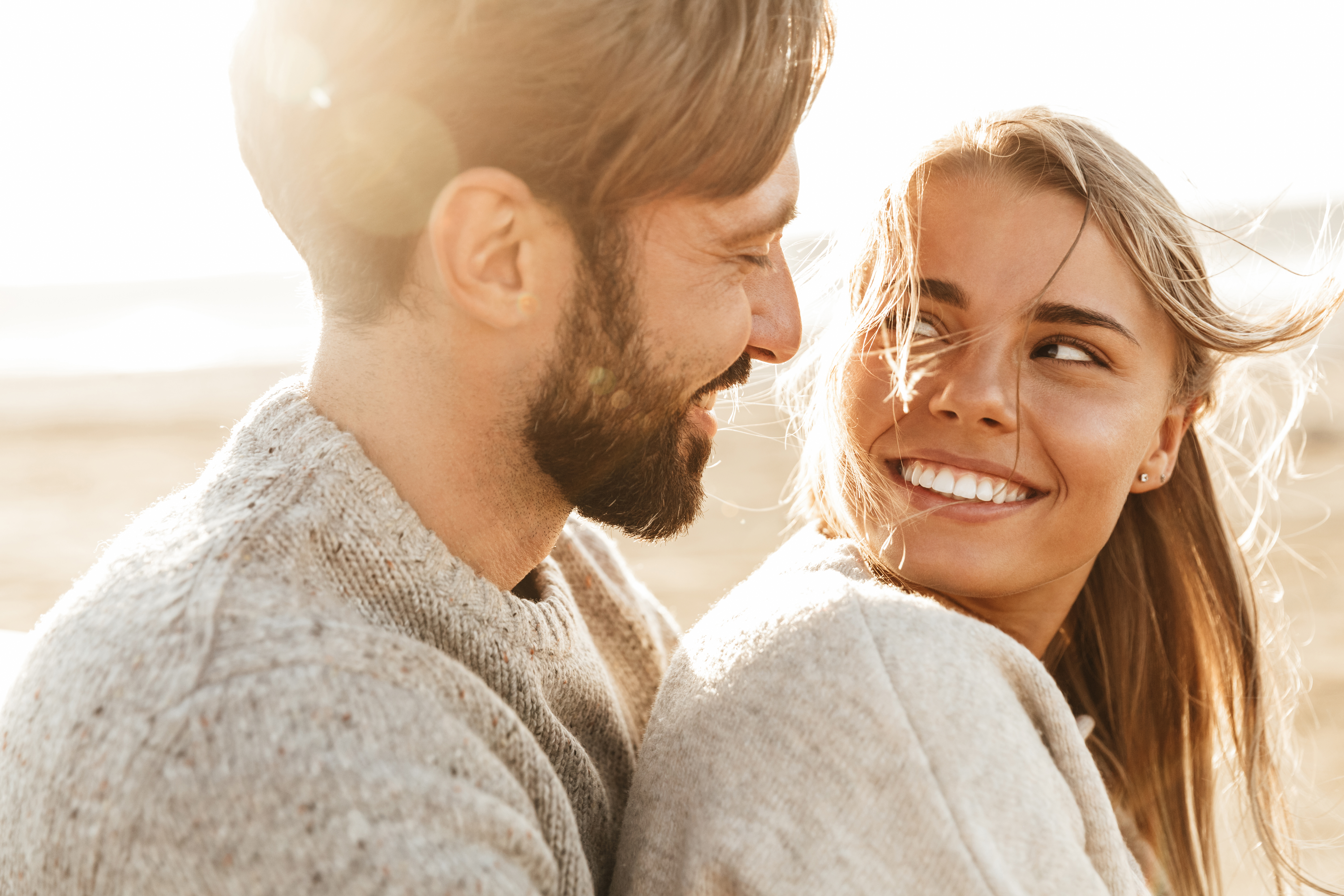 A couple smiling at each other | Source: Shutterstock