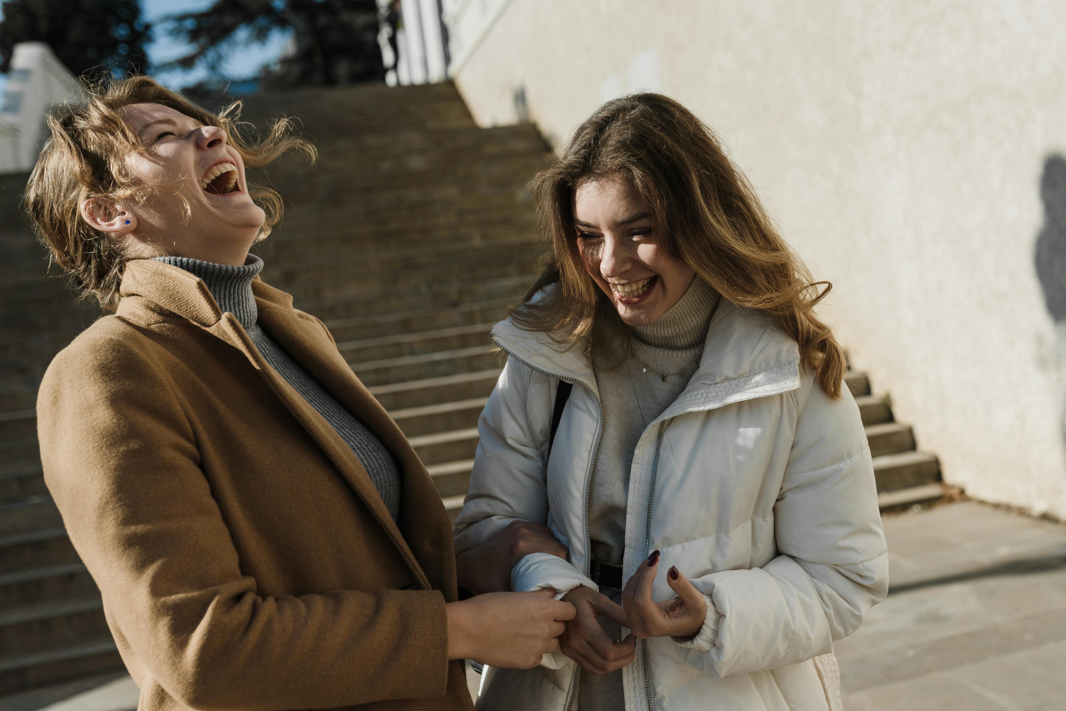 Two friends laughing | Source: Pexels