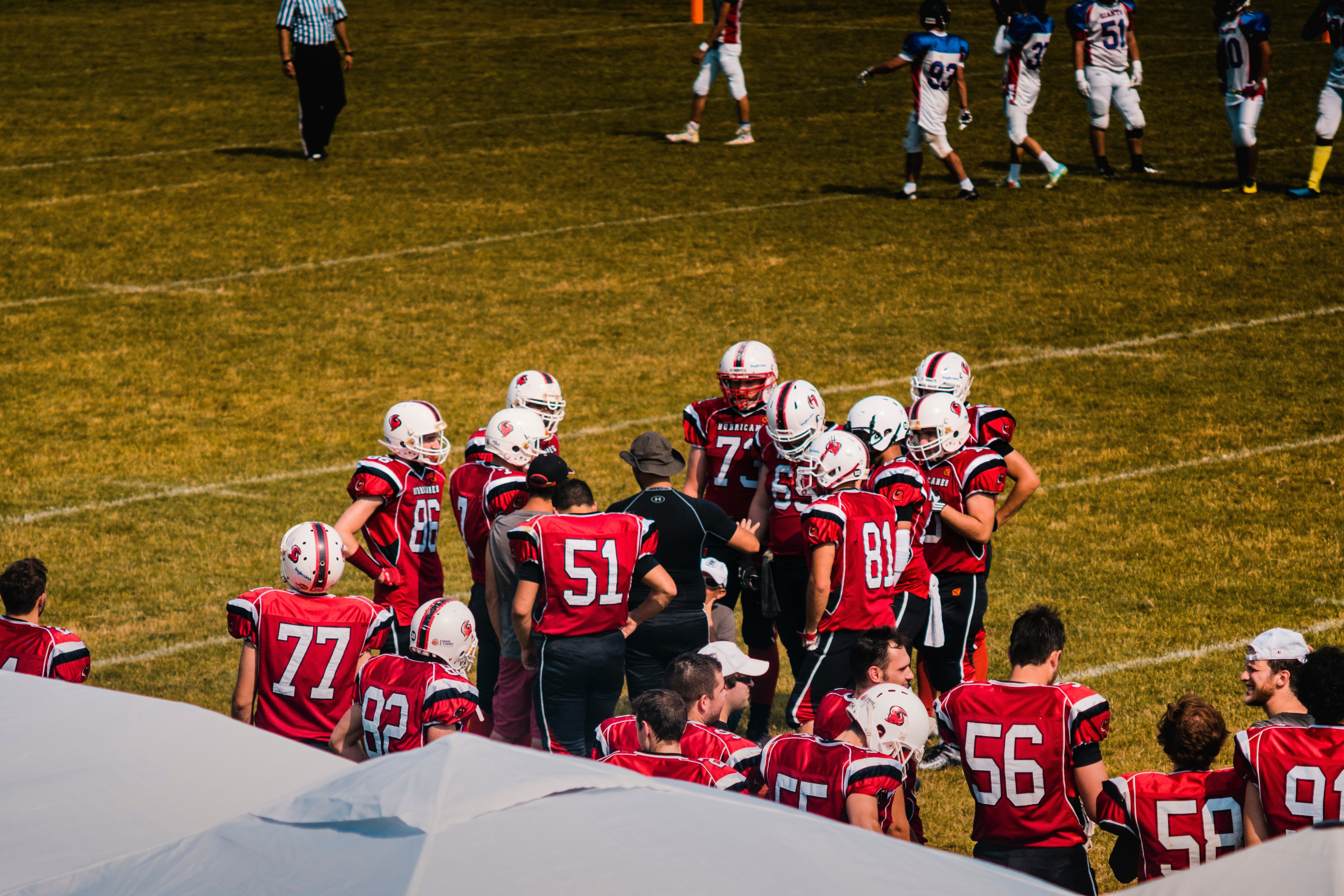 A football team on the side of the field. | Source: Pexel