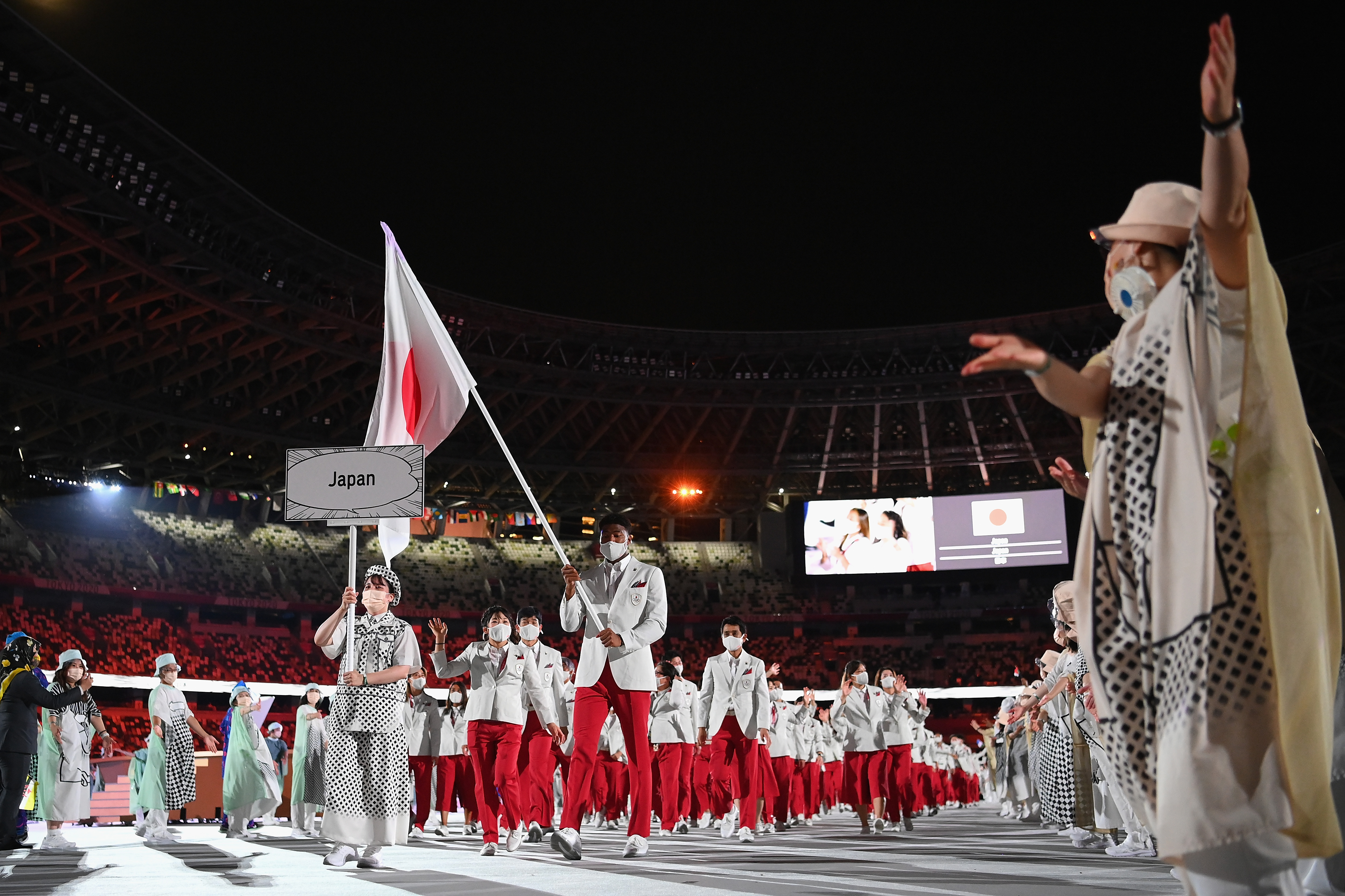 Flag bearers Yui Susaki and Rui Hachimura of Team Japan lead their team in during the Opening Ceremony of the Tokyo 2020 Olympic Games at Olympic Stadium, on July 23, 2021, in Tokyo, Japan.| Source: Getty Images
