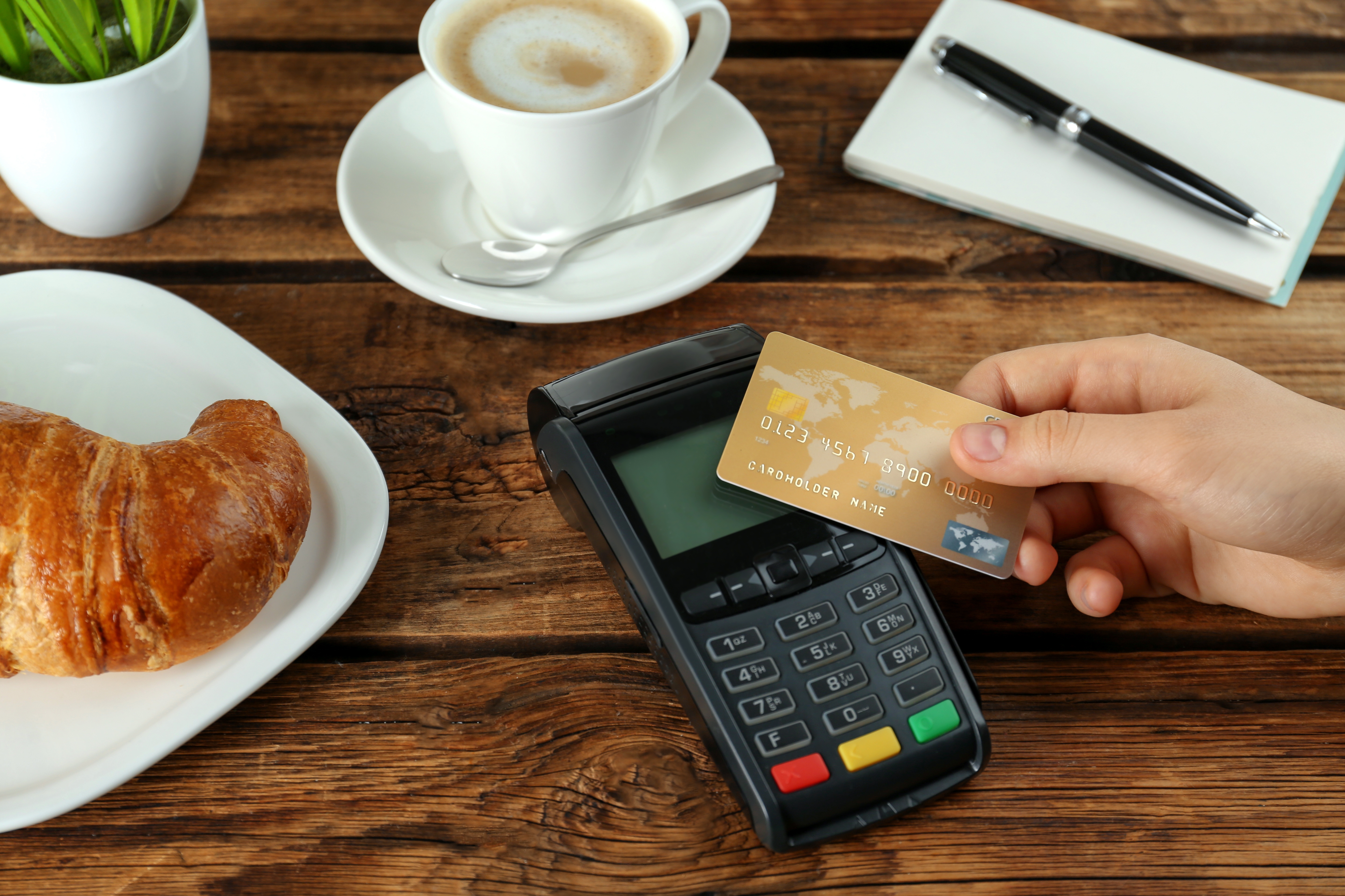 A person paying with a card | Source: Shutterstock
