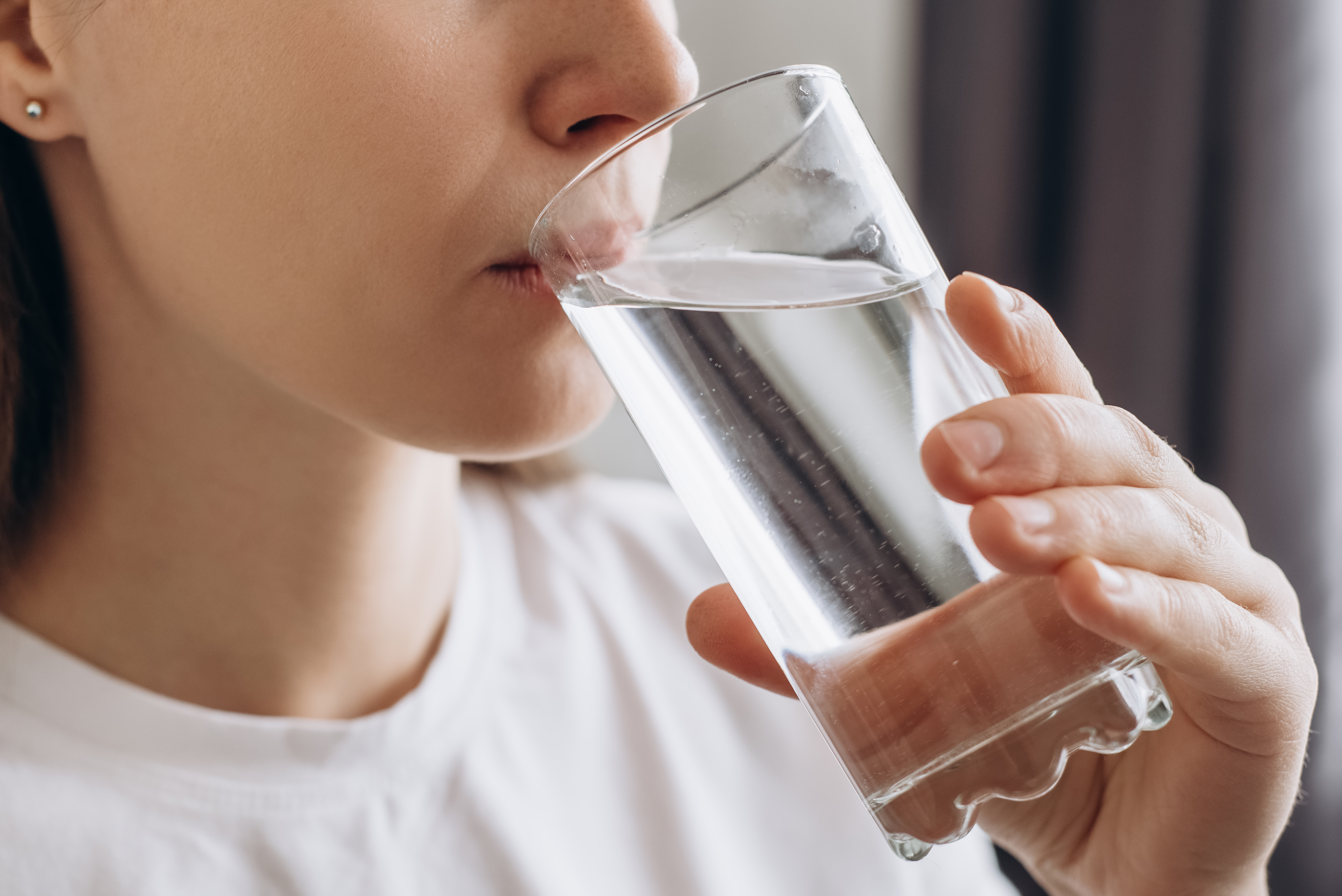 A woman drinking from a glass | Source: Getty Images