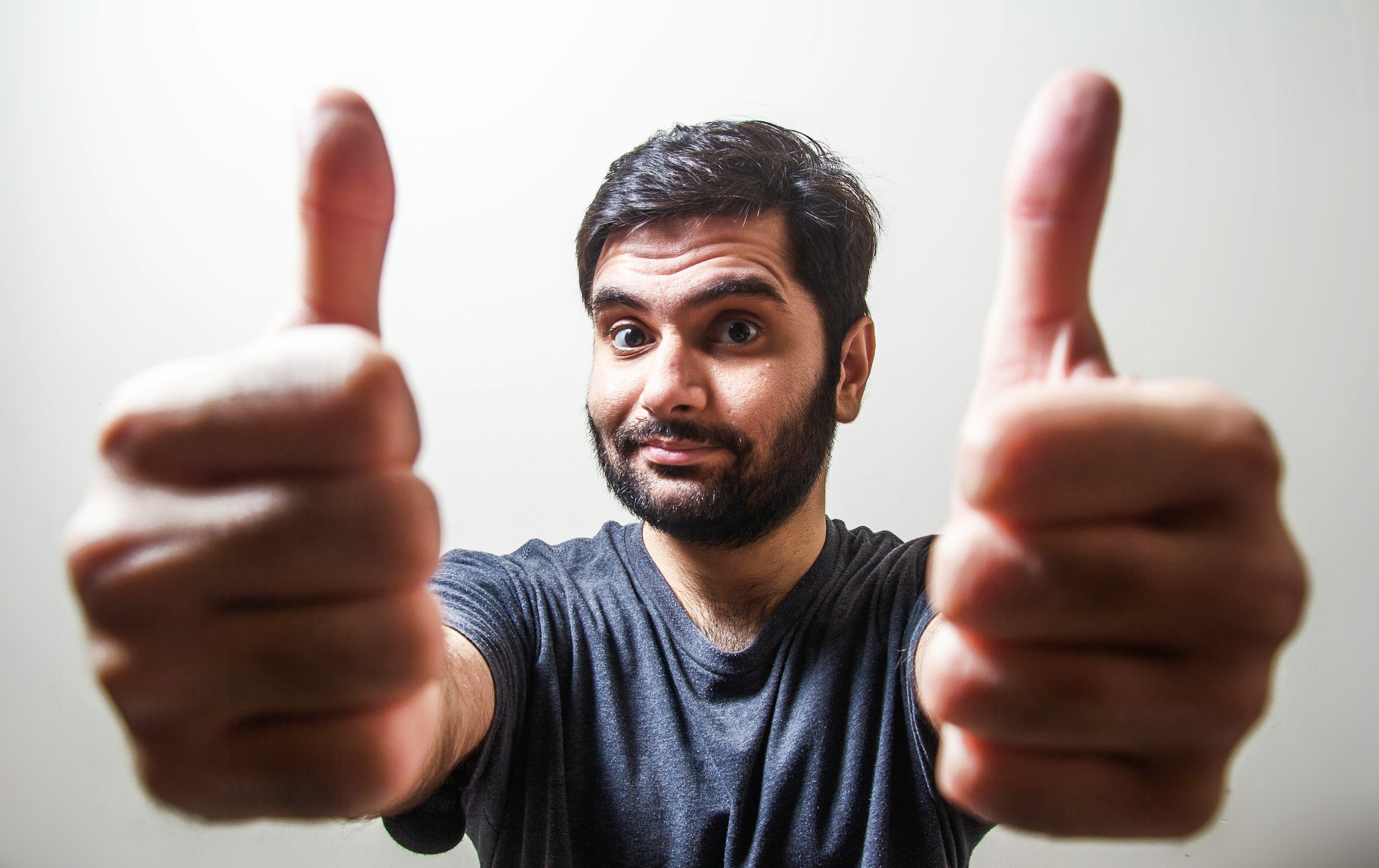 A man showing two thumbs-up | Source: Unsplash