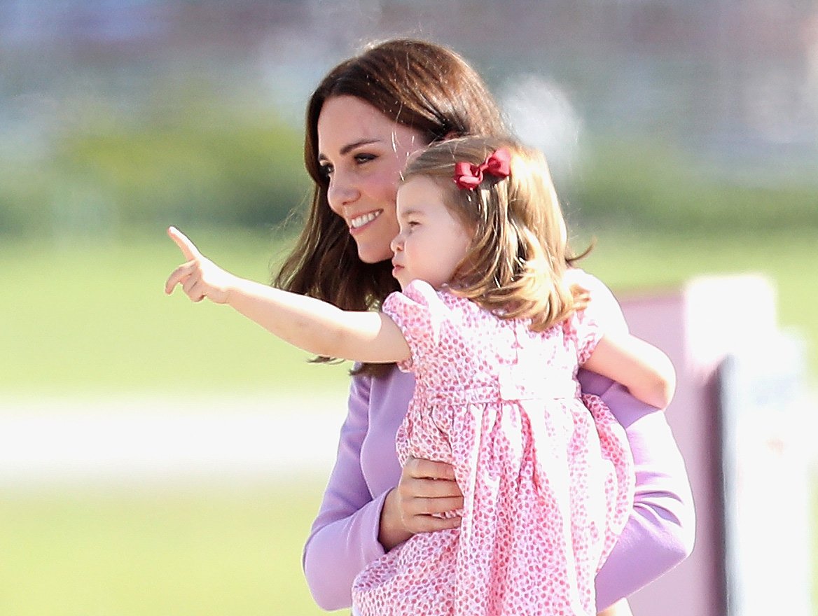 Duchess of Cambridge and Princess Charlotte before departing from Hamburg airport on the last day of their official visit to Poland and Germany on July 21, 2017. | Source: Getty Images