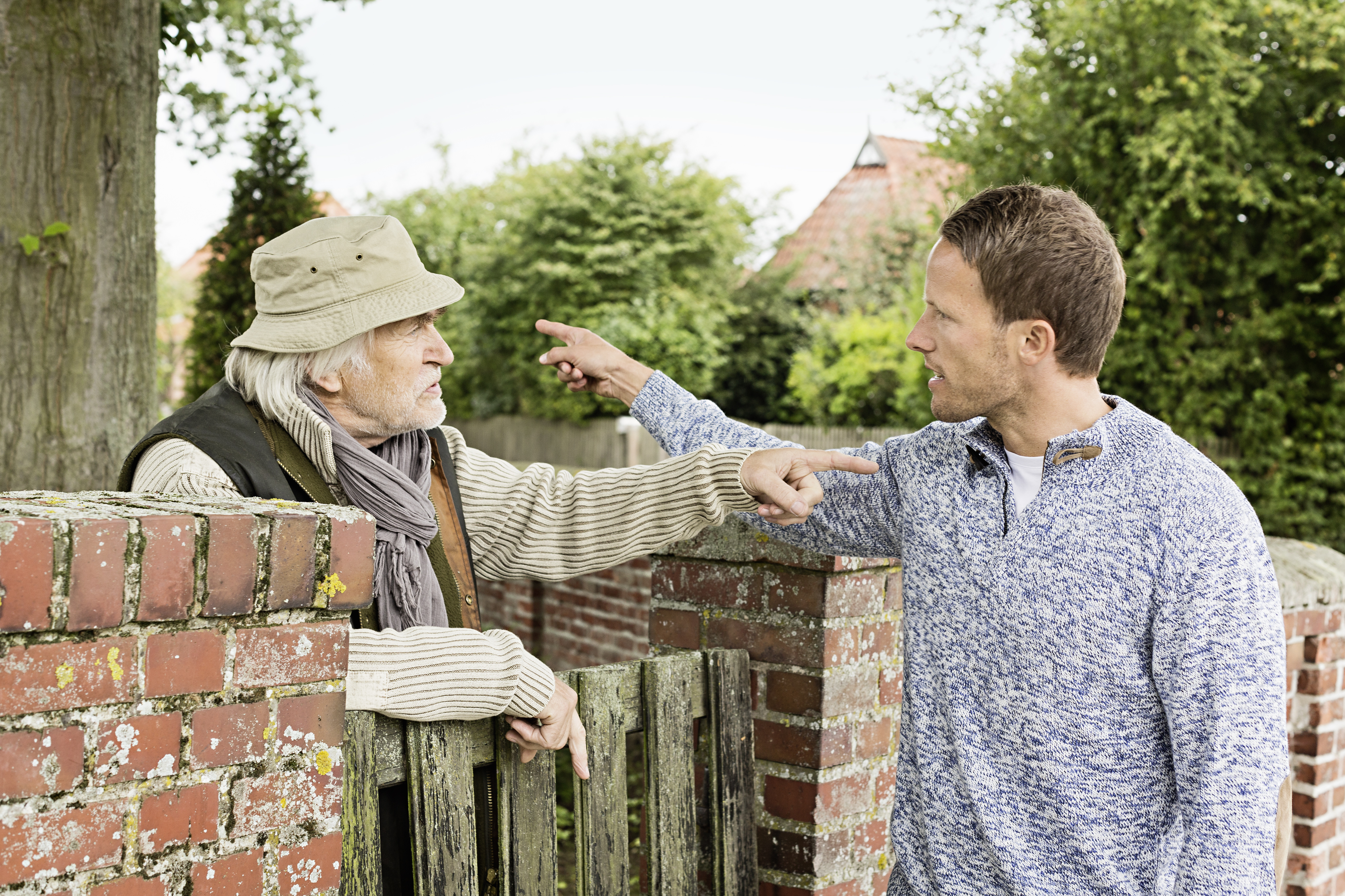 A senior citizen and adult man having an argument | Source: Getty Images