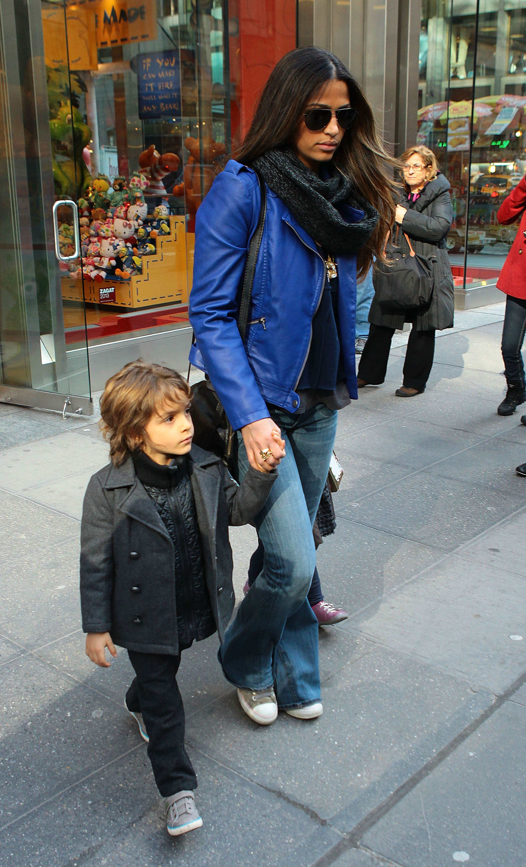 Style is in his DNA — Rocking a charcoal coat and sneakers, Levi strolls through New York hand-in-hand with his mom on March 15, 2013.
