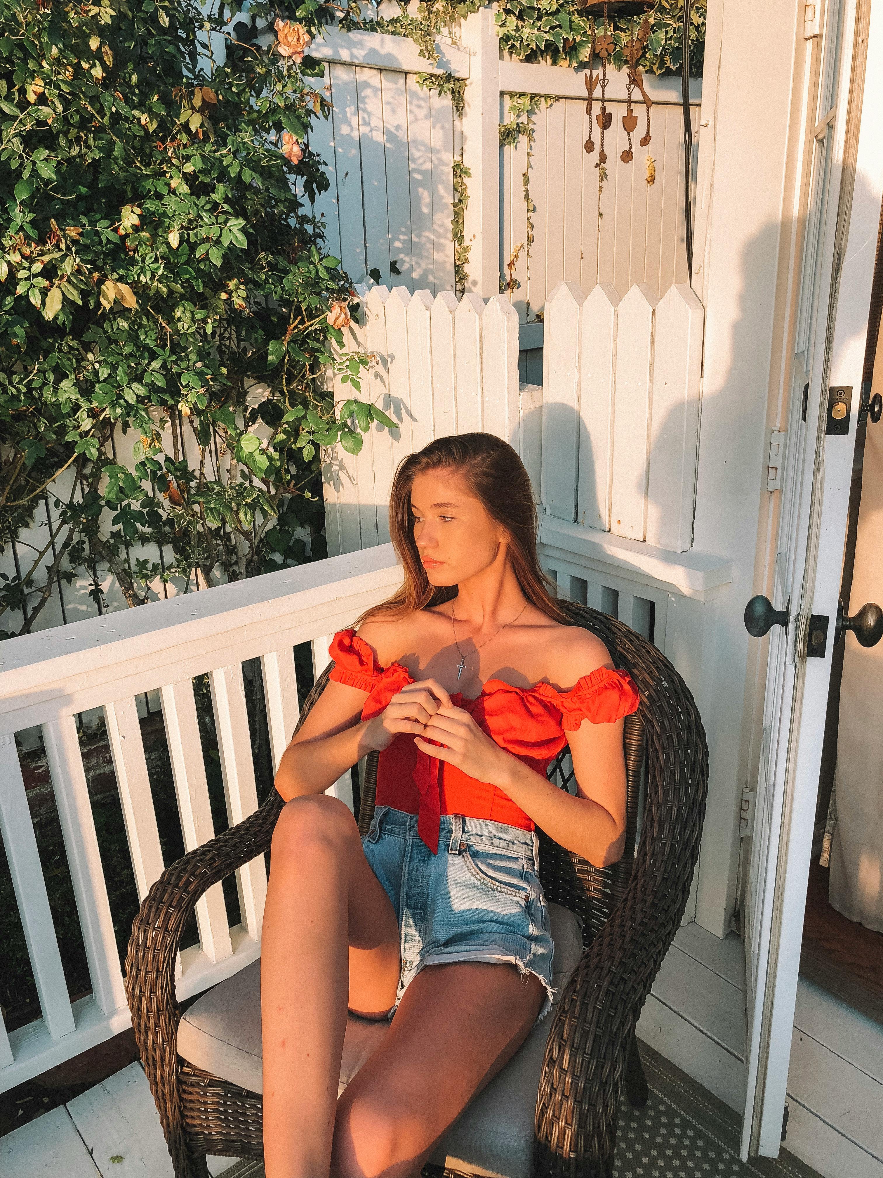 A woman sitting on a chair | Source: Pexels