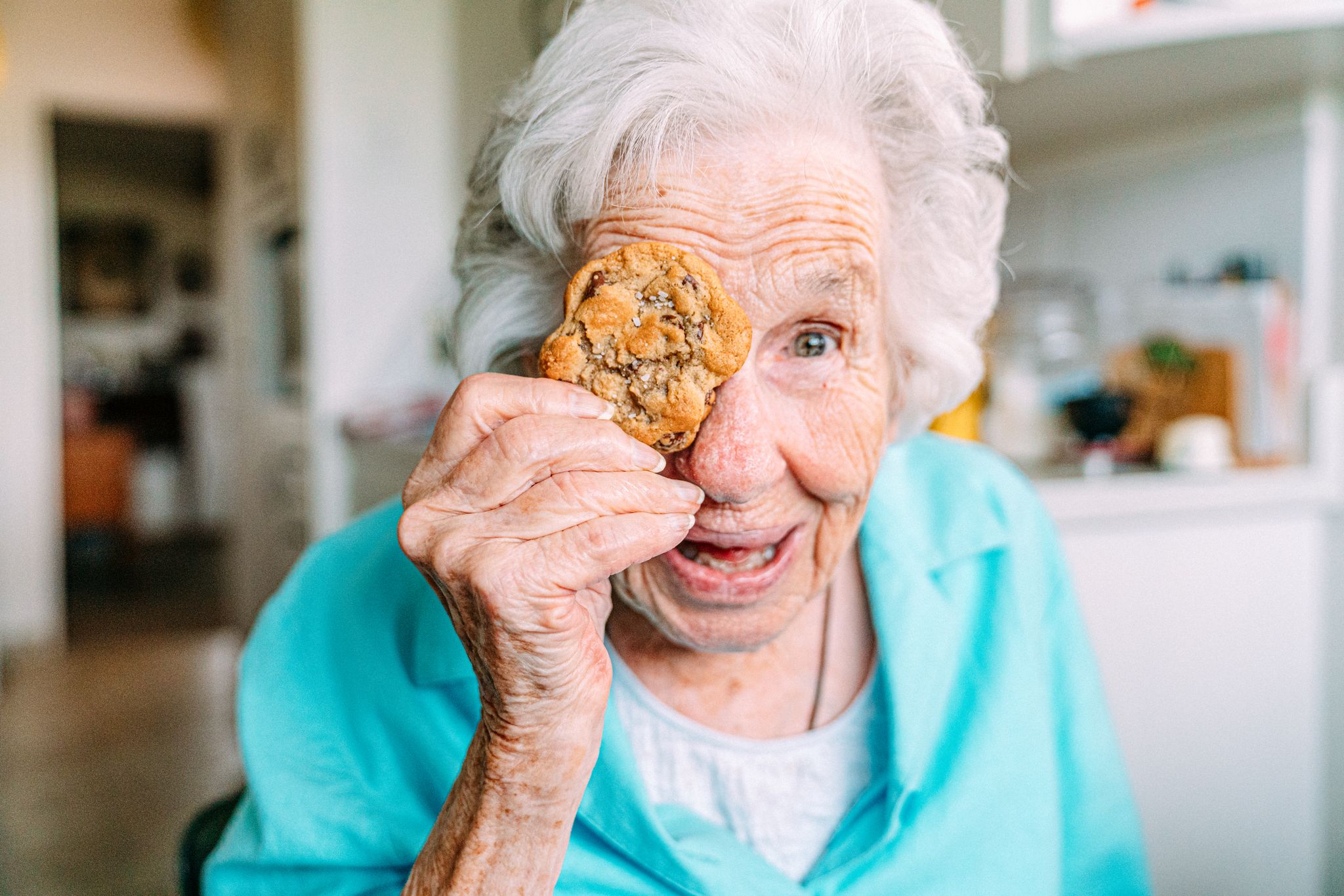 A grandmother holding a cookie. | Source: Getty Images
