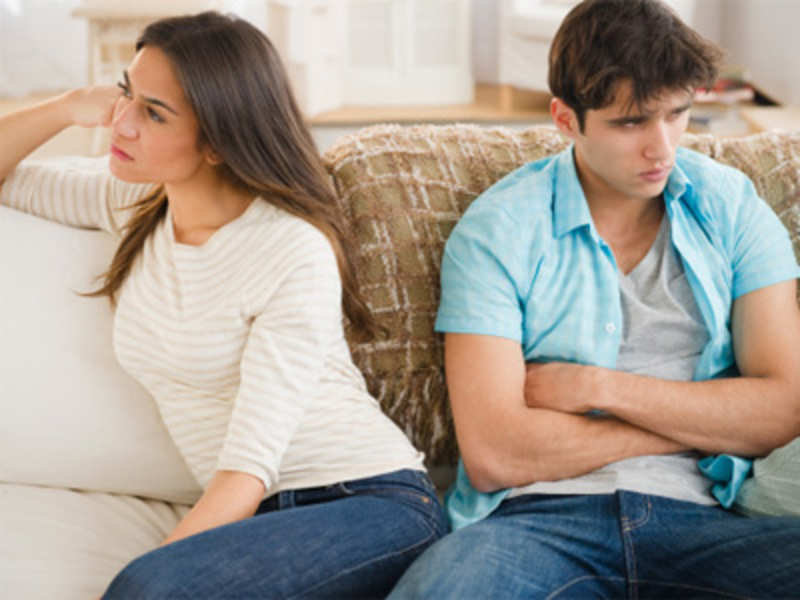 A man and a woman having an argument in their living room | Photo: Shutterstock