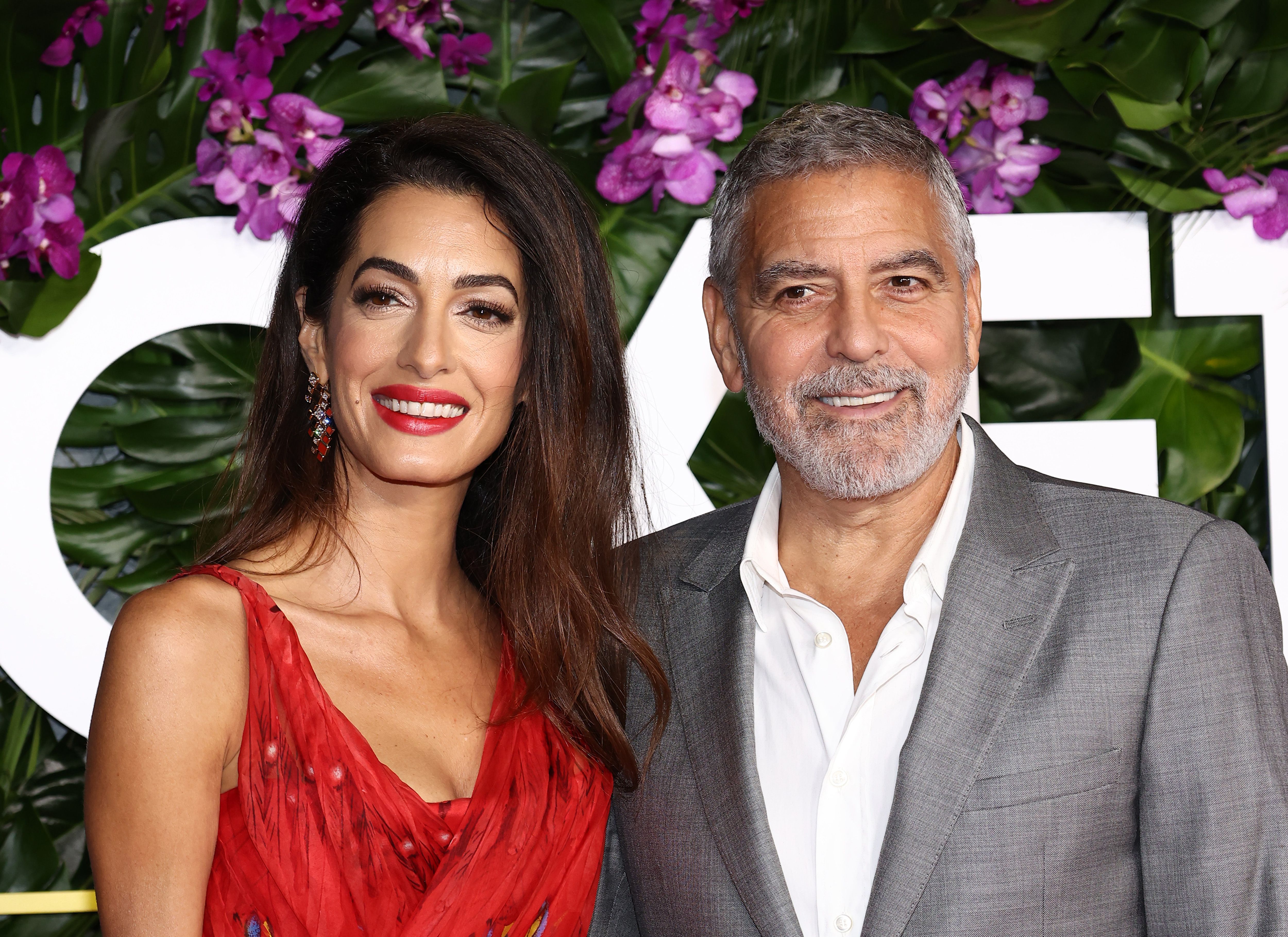Amal Clooney and George Clooney attend the premiere of "Ticket To Paradise" at Regency Village Theatre on October 17, 2022 in Los Angeles, California | Source: Getty Images