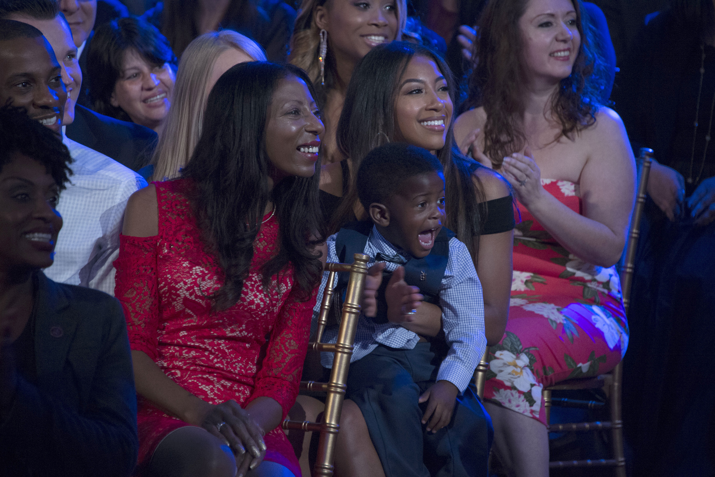 Calvin Johnson Jr.'s mother, Arica, Brittney McNorton, and Calvin's son, watches the "Dancing with the Stars" semi-finals live on November 21, 2016, at ABC. | Source: Getty Images