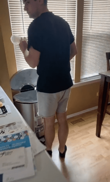 Jake removing and dumping the sanitary pad in the trash | Photo: Tiktok.com/@kenzielynnsmith