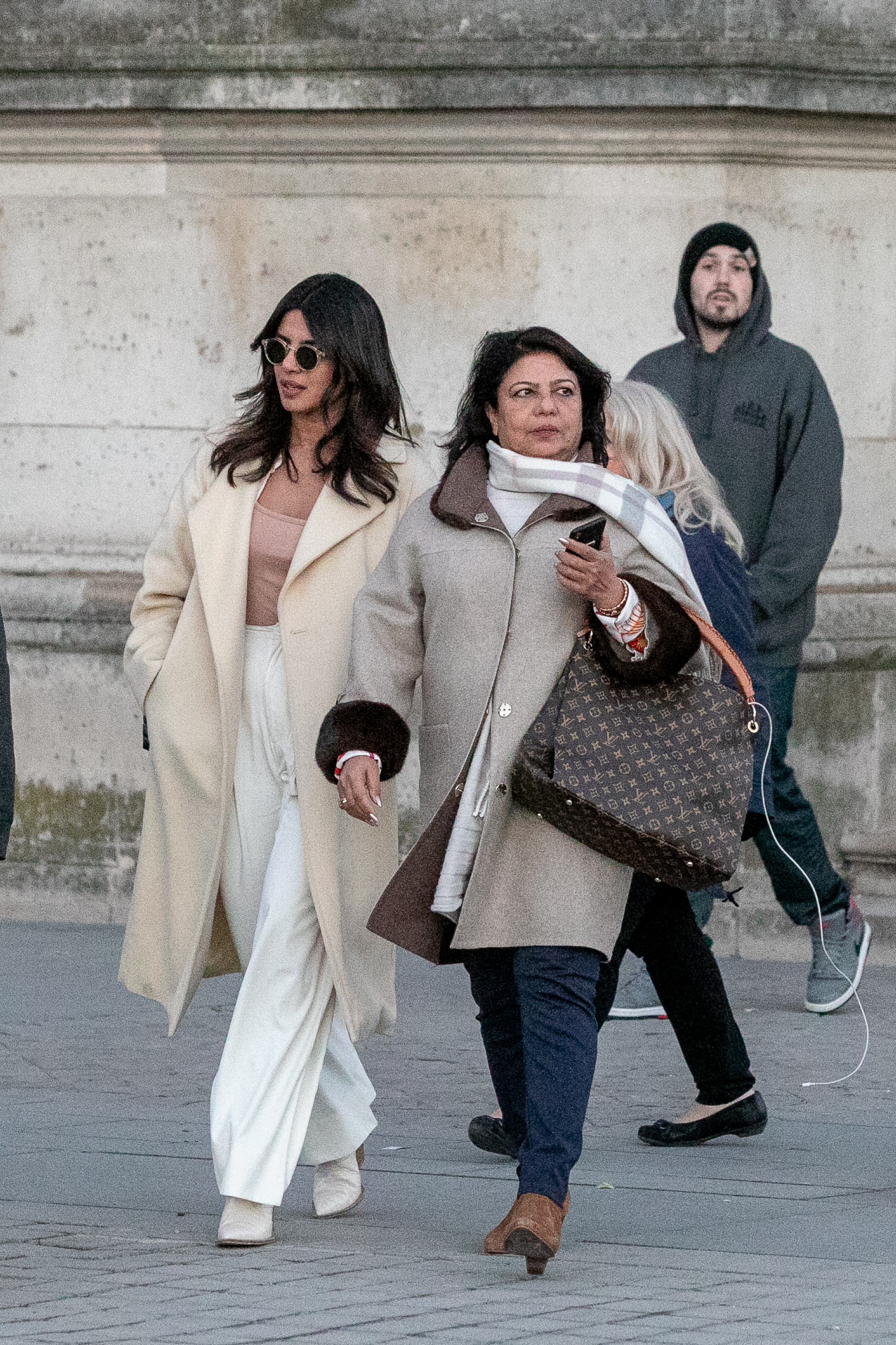 Priyanka Chopra and her mother Madhu Chopra are seen leaving the Cafe Marly, at Louvre museum, on November 18, 2018, in Paris, France. | Source: Getty Images