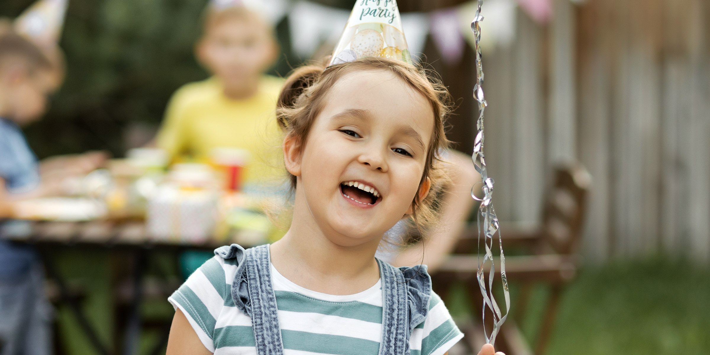 A happy child at her birthday party | Source: Shutterstock