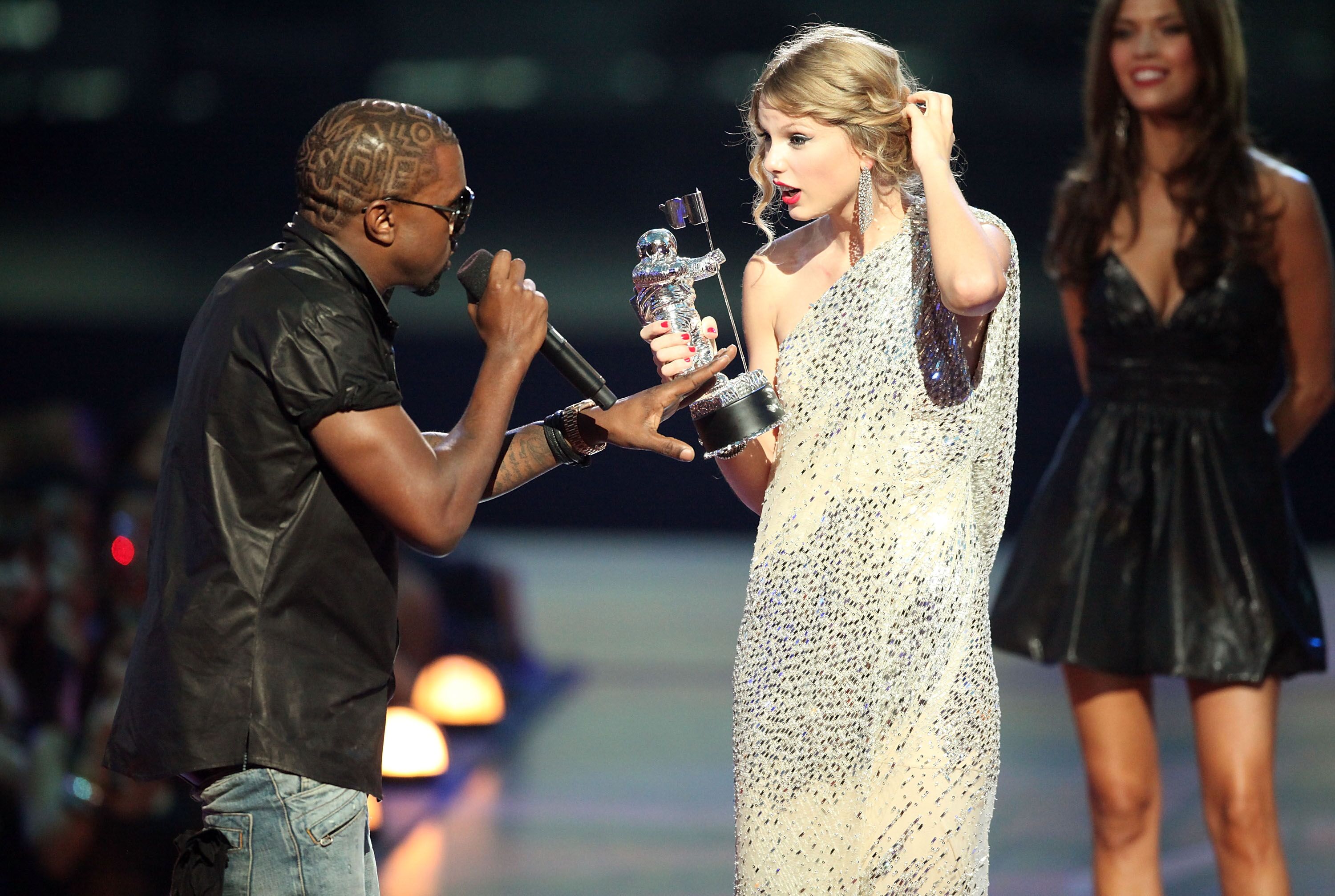 Kanye West jumps onstage after Taylor Swift won the "Best Female Video" award during the 2009 MTV Video Music Awards at Radio City Music Hall on September 13, 2009, in New York City. | Source: Getty Images.
